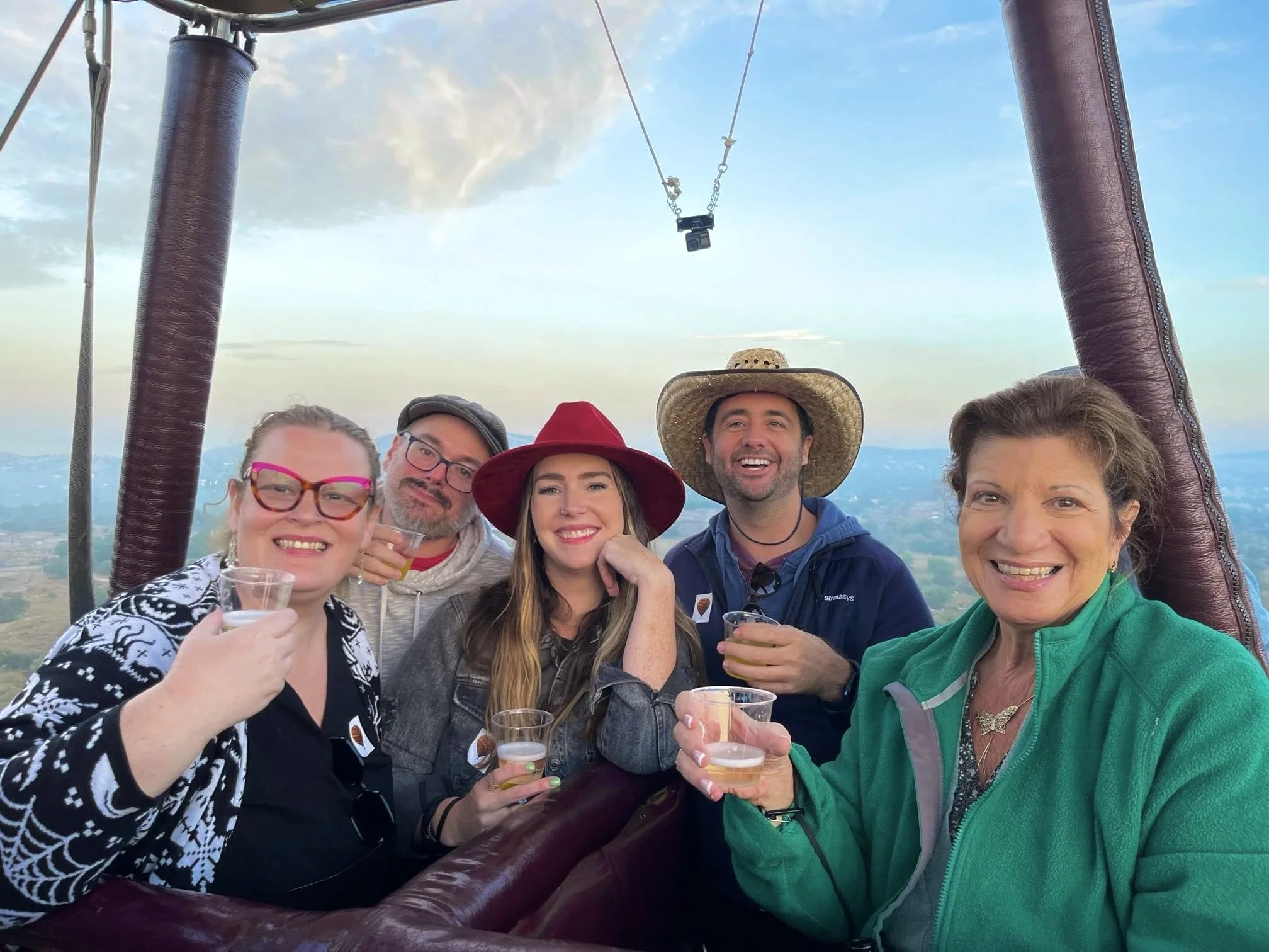 Group riding in a hot air balloon.