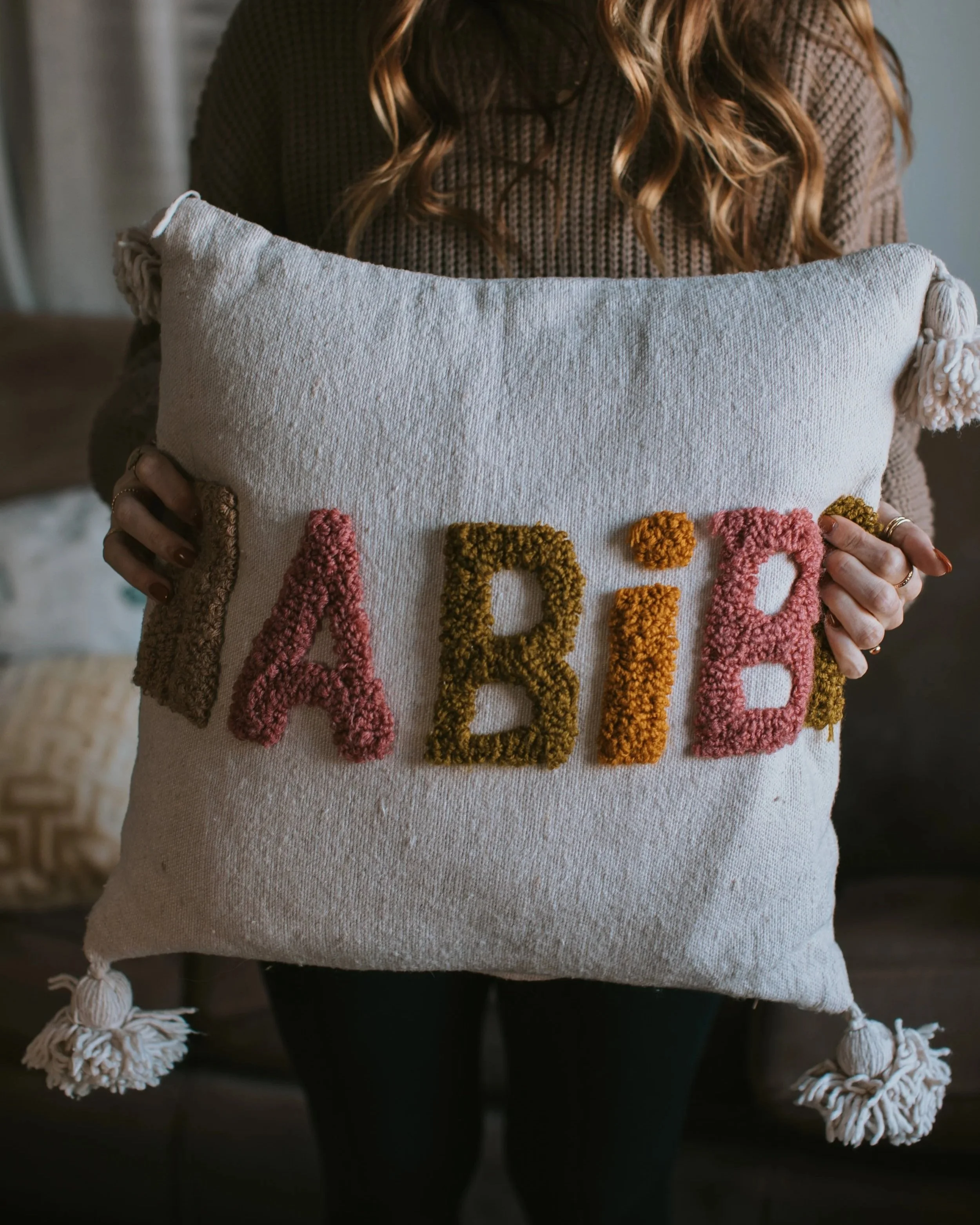 Embroidered pillow with the Arabic word "habibi" from a Marrakech textile shop.