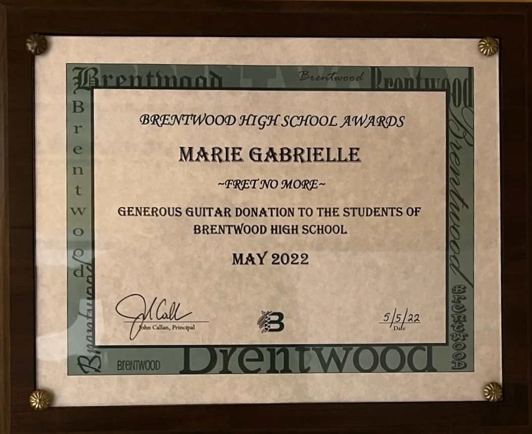 Certificate of appreciation awarded to Marie Gabrielle for a generous guitar donation to Brentwood High School in May 2022, signed by Principal John Callan.