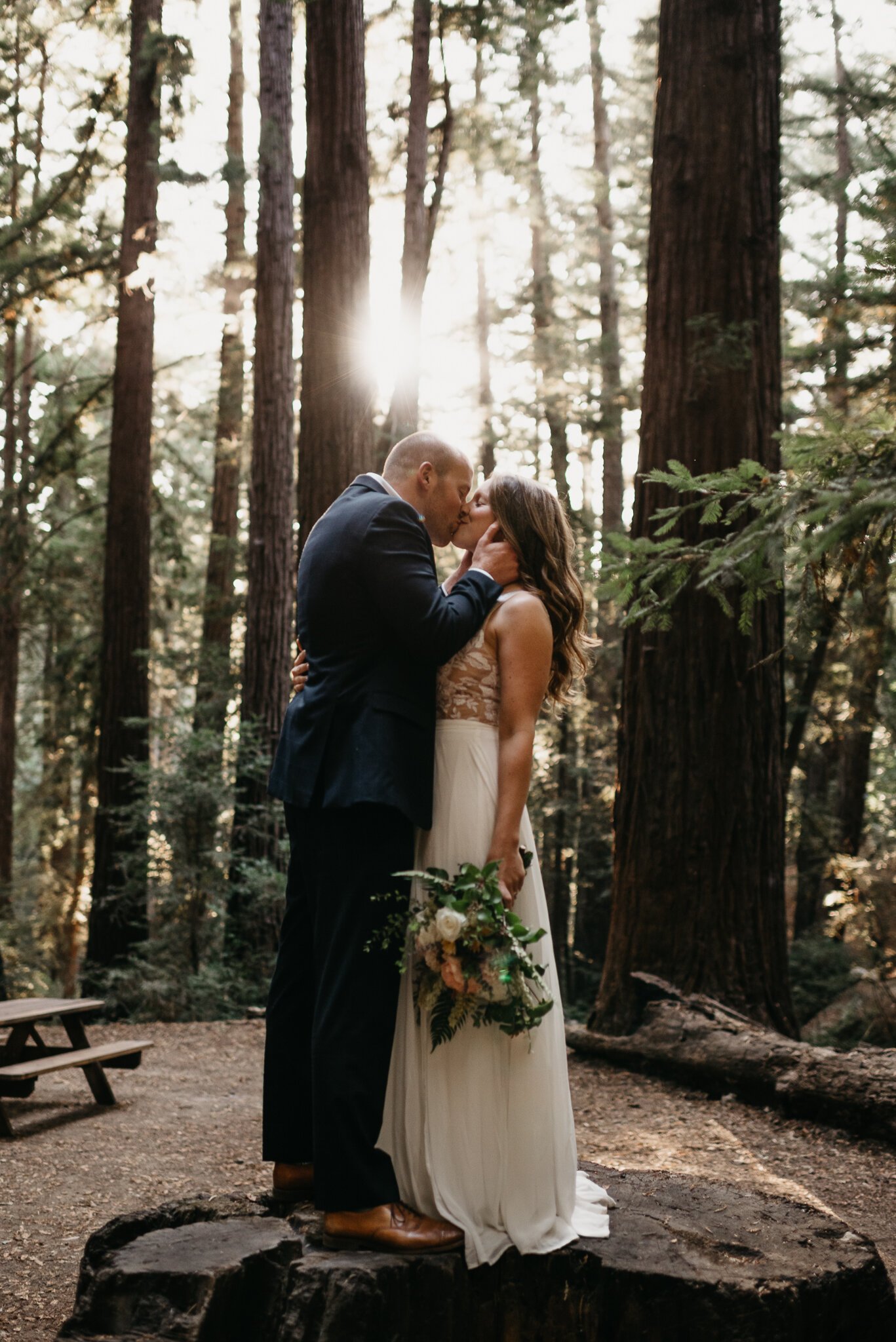 Ventana Big Sur Elopement couple kissing under the redwood trees
