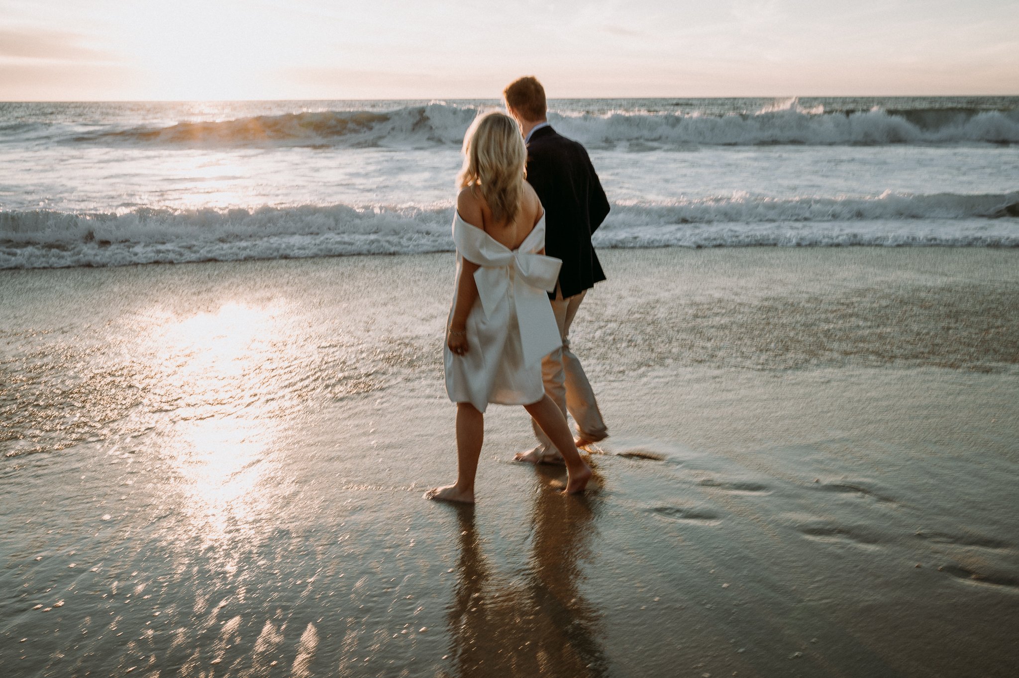 Couple-walking-Big-Sur-Garrapata-beach-engagement