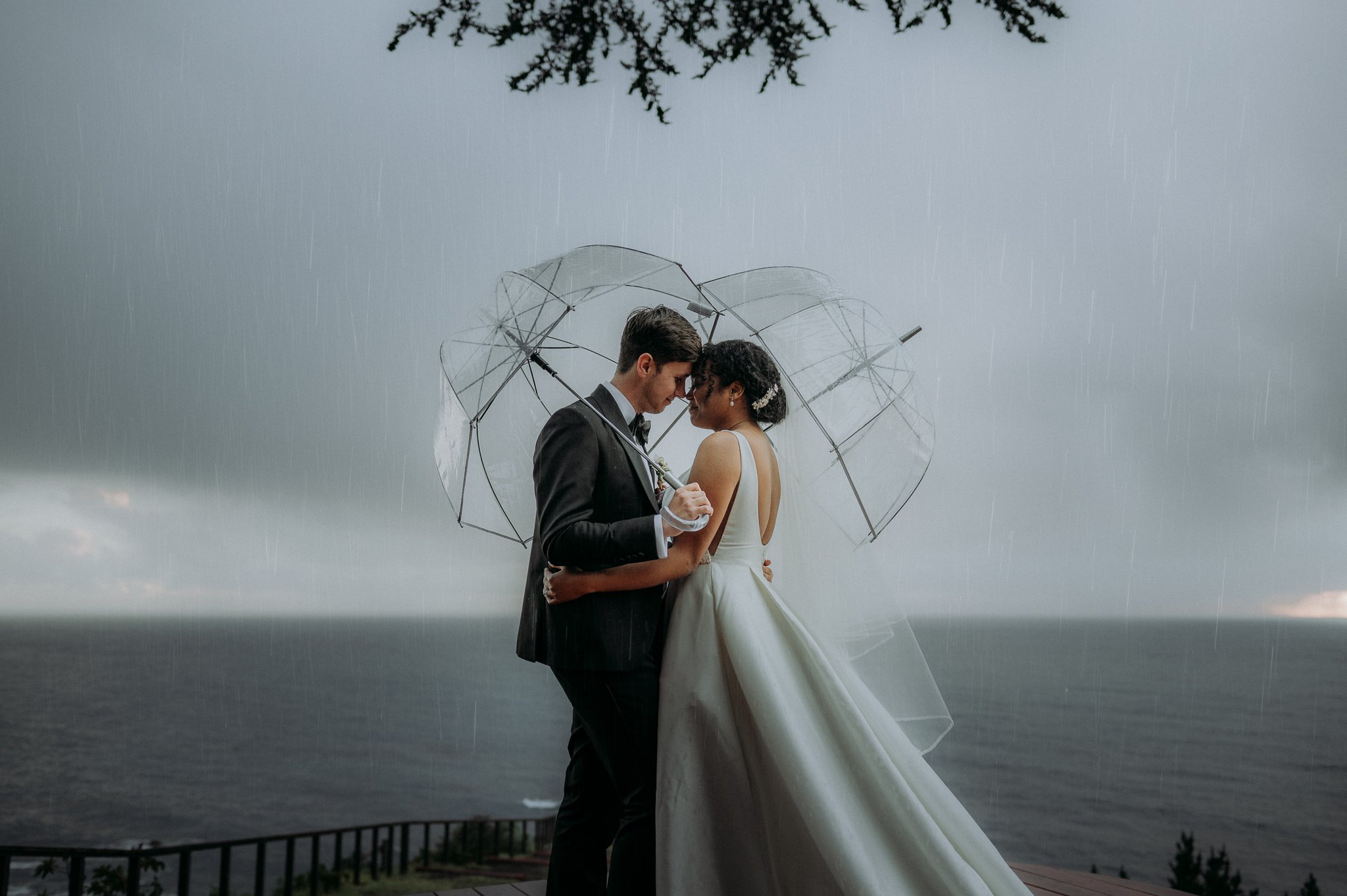 Big-Sur-Wedding-rain-bride-and-groom-umbrellas