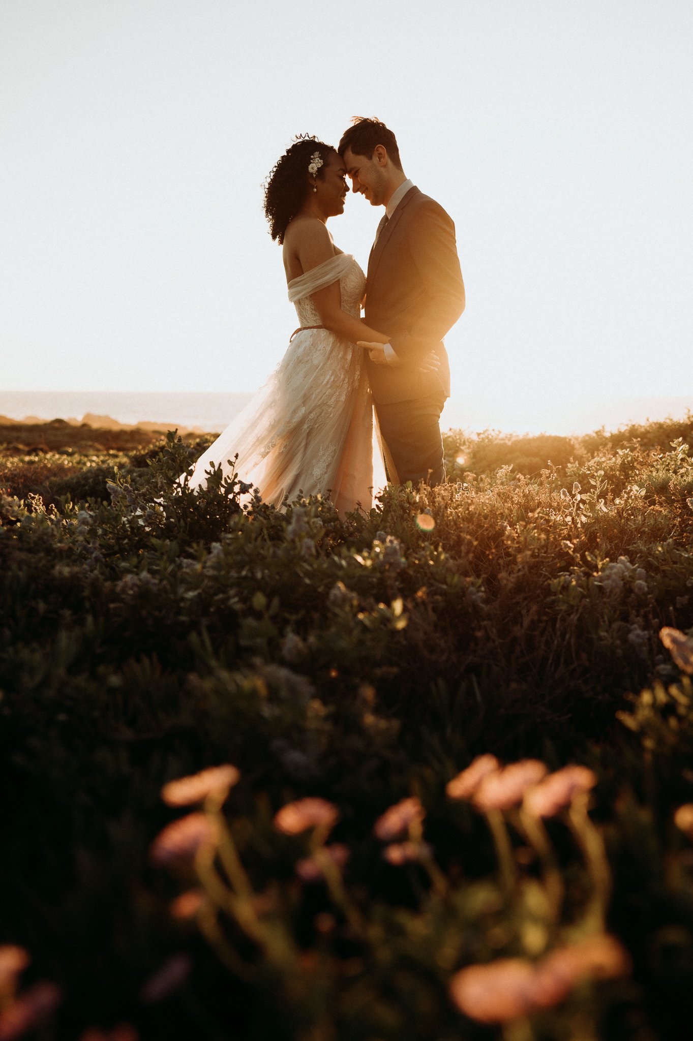 Bride-and-groom-Big-Sur-sunset-Cliffside-post-Wedding-day-adventure
