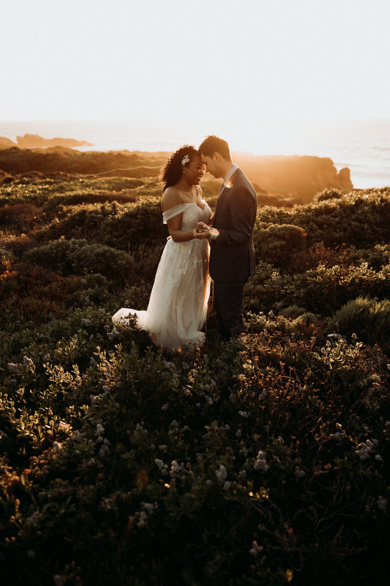 Bride-and-groom-Big-Sur-sunset-Cliffside-post-Wedding-day-adventure