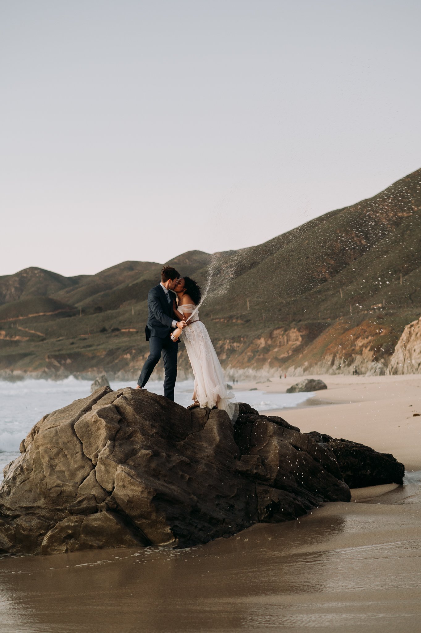 Big-Sur-Beach-Wedding-Celebration-champagne-and-kiss