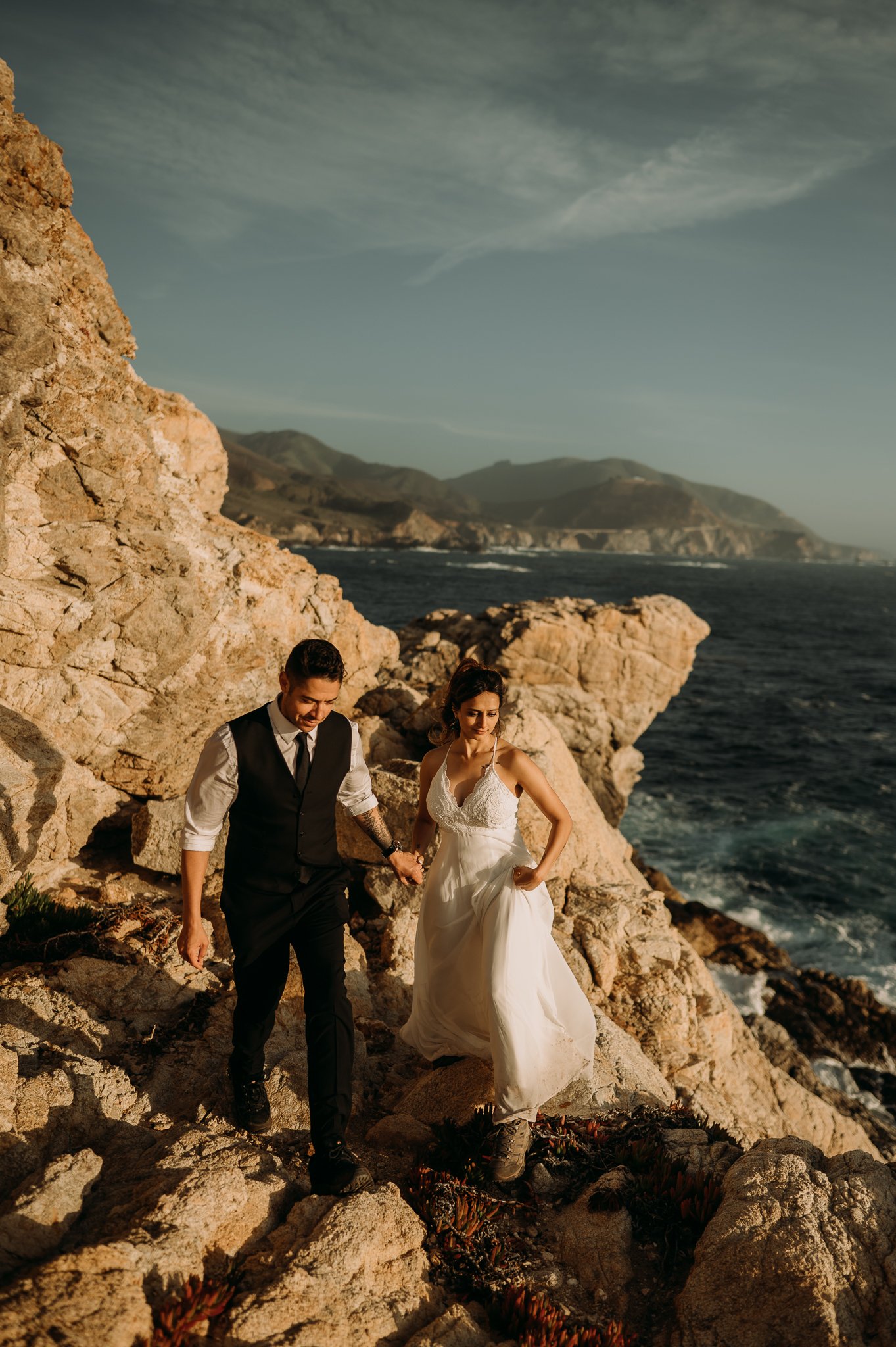 Newlyweds photography session couple walking cliffside Big Sur California