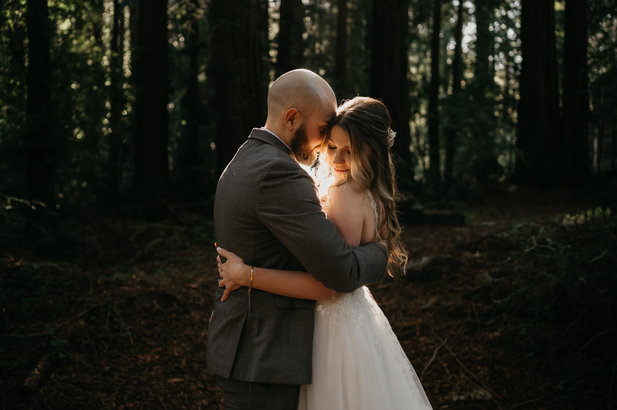  bride and groom enbracing during elopement ceremony in Big Sur California