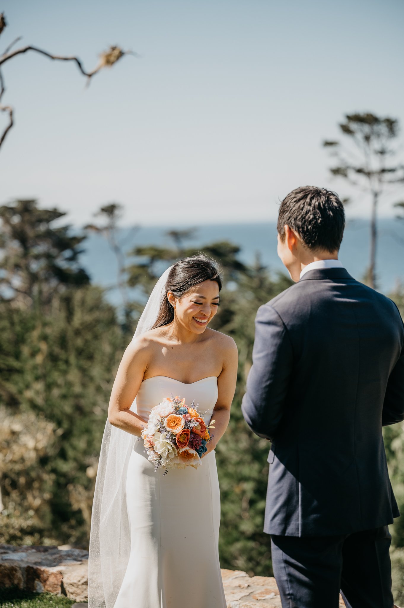 Bride laughing during ceremony Pebble Beach, California