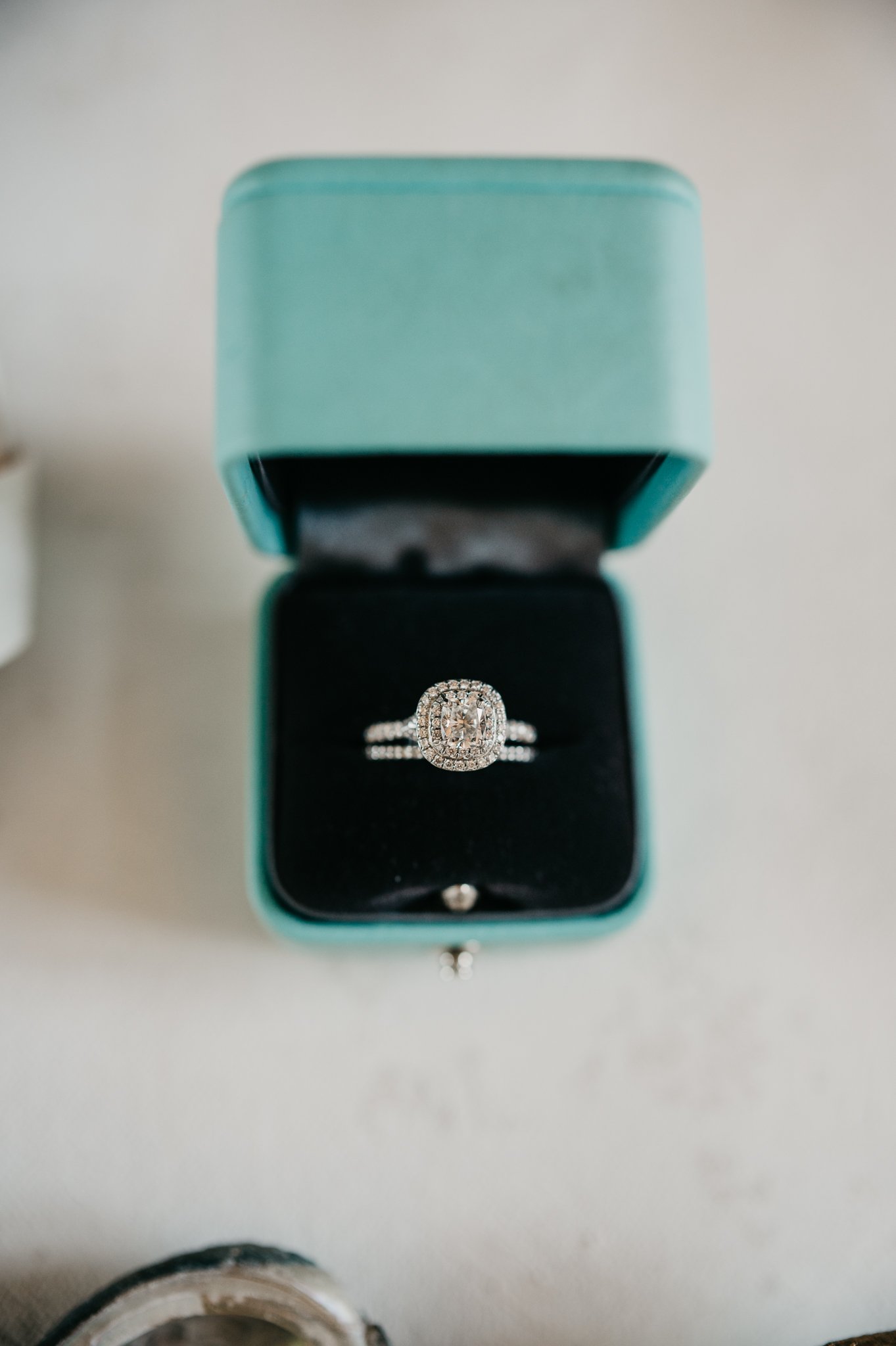 diamond engagement rings in a turquoise ring box