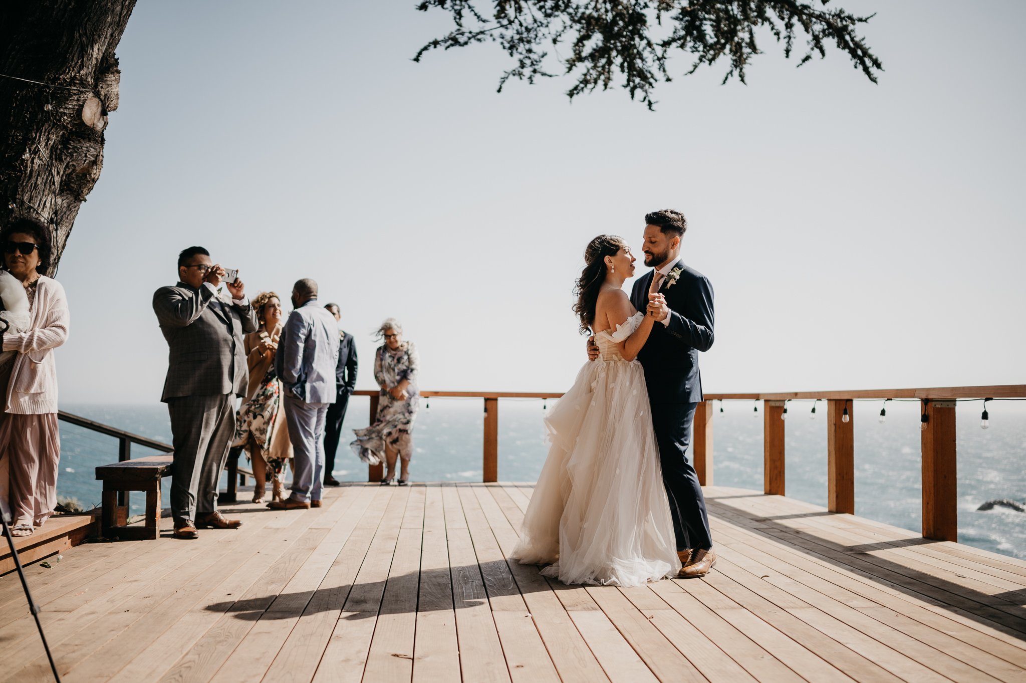 Bride and groom first dance on deck at Wind and Sea Big Sur