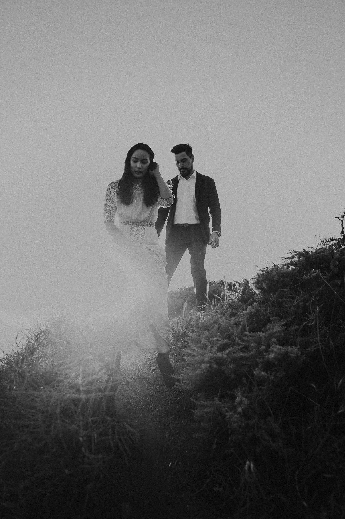black and white shot of engagement couple was downhill in Big Sur