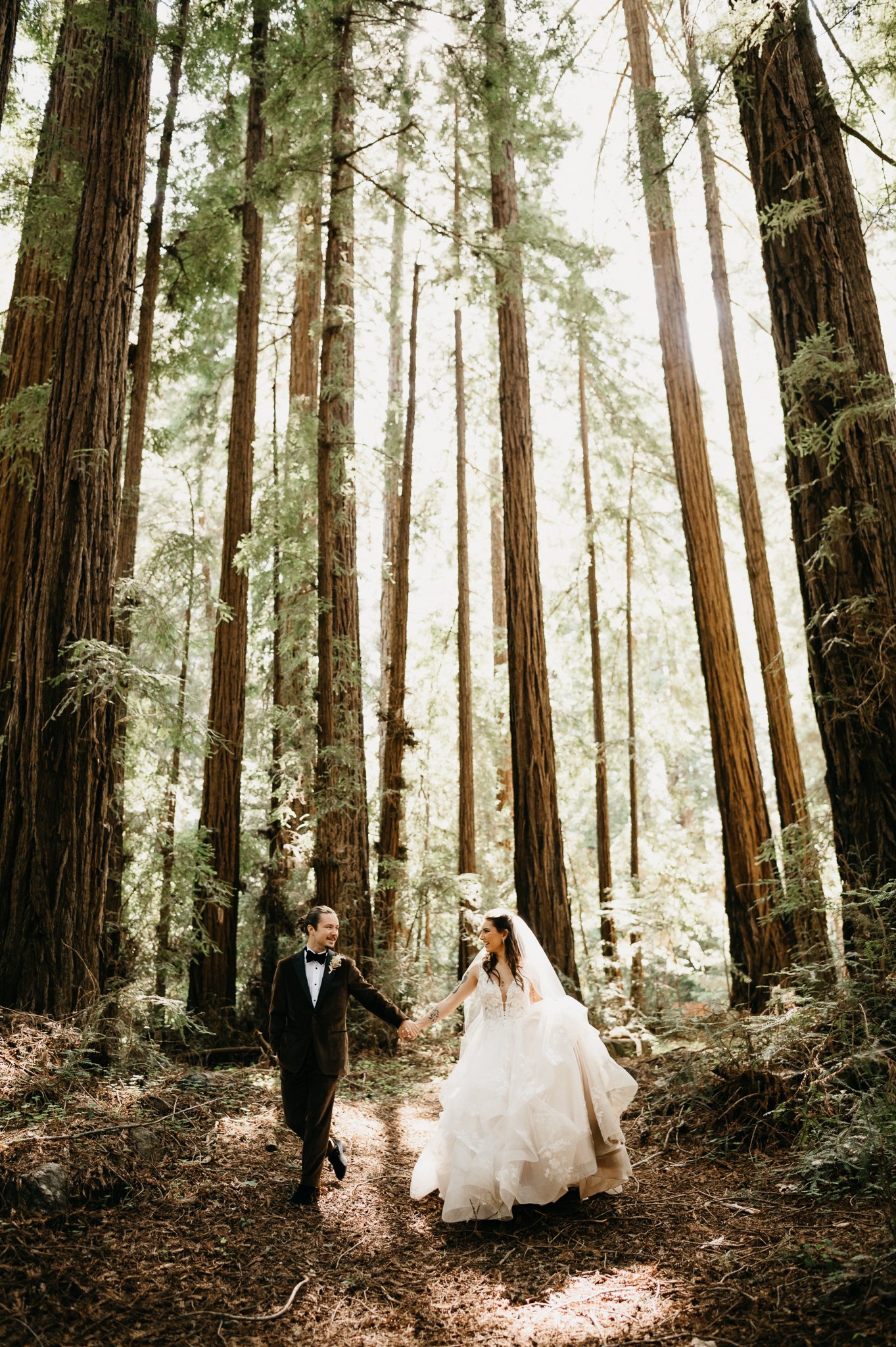 Forest Big Sur Bride and groom first look among the tall redwoods