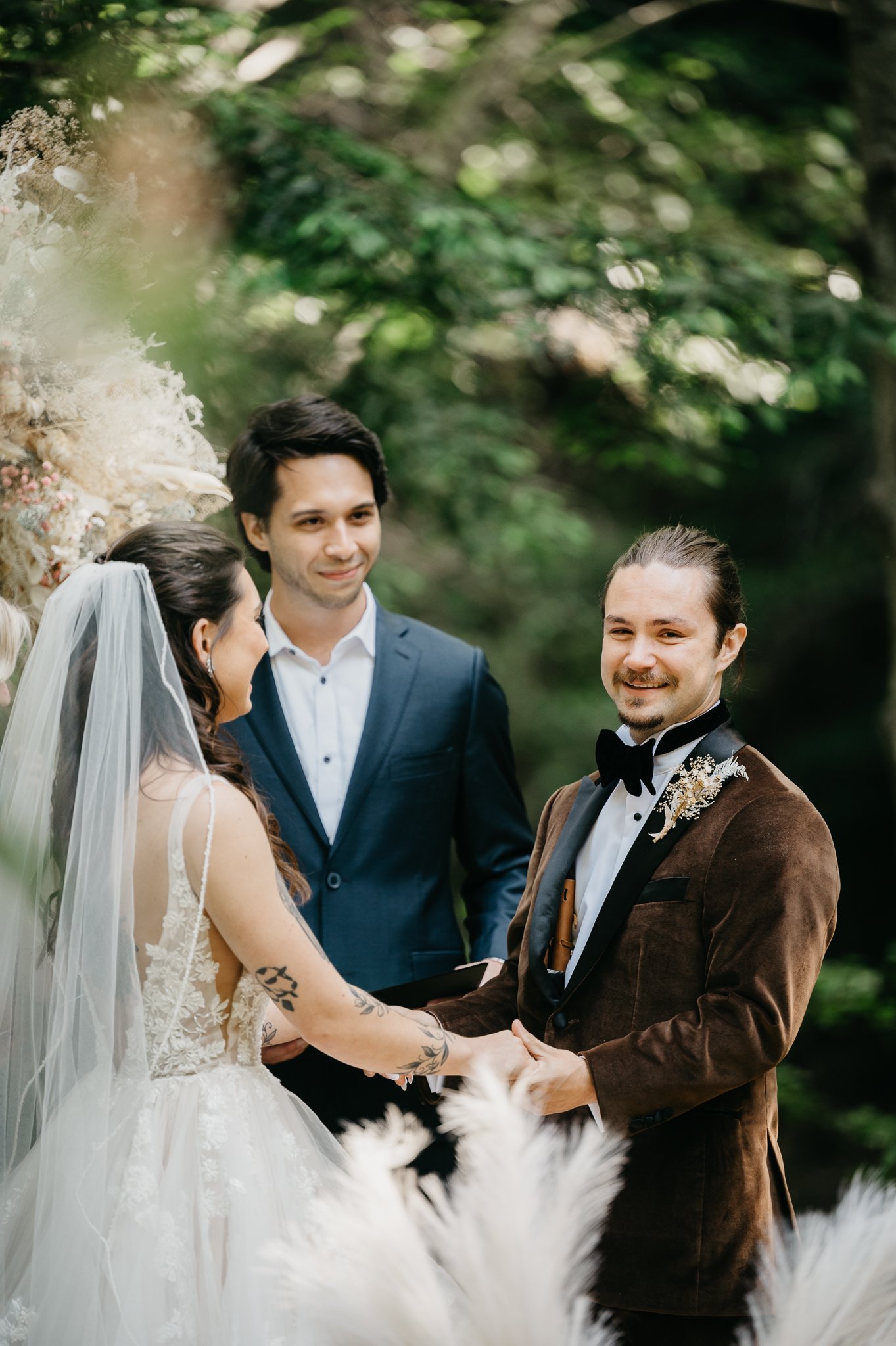 Big Sur Wedding bride and groom at alter under trees 