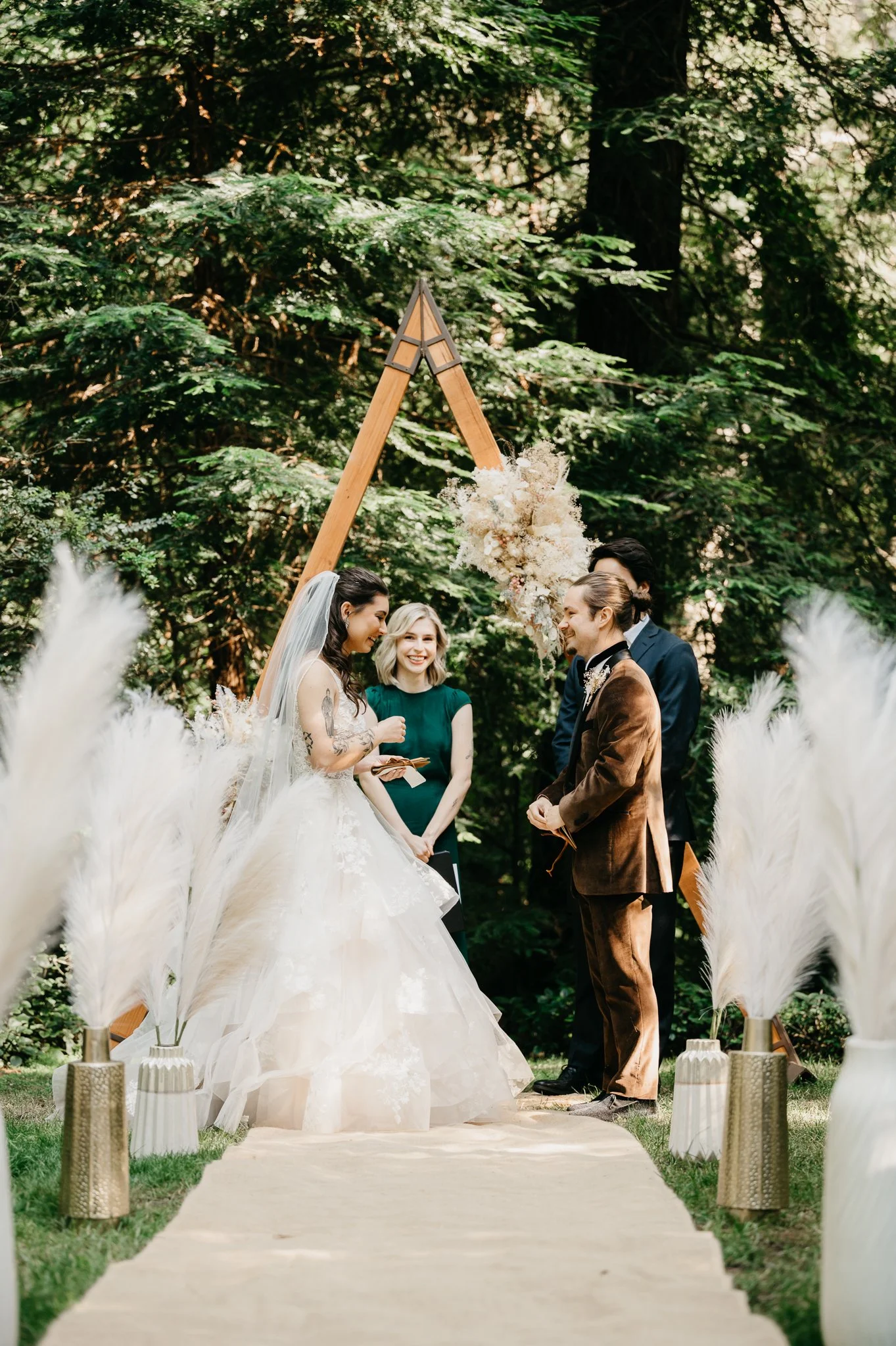 Big Sur wedding bride and groom at wooden alter under the trees