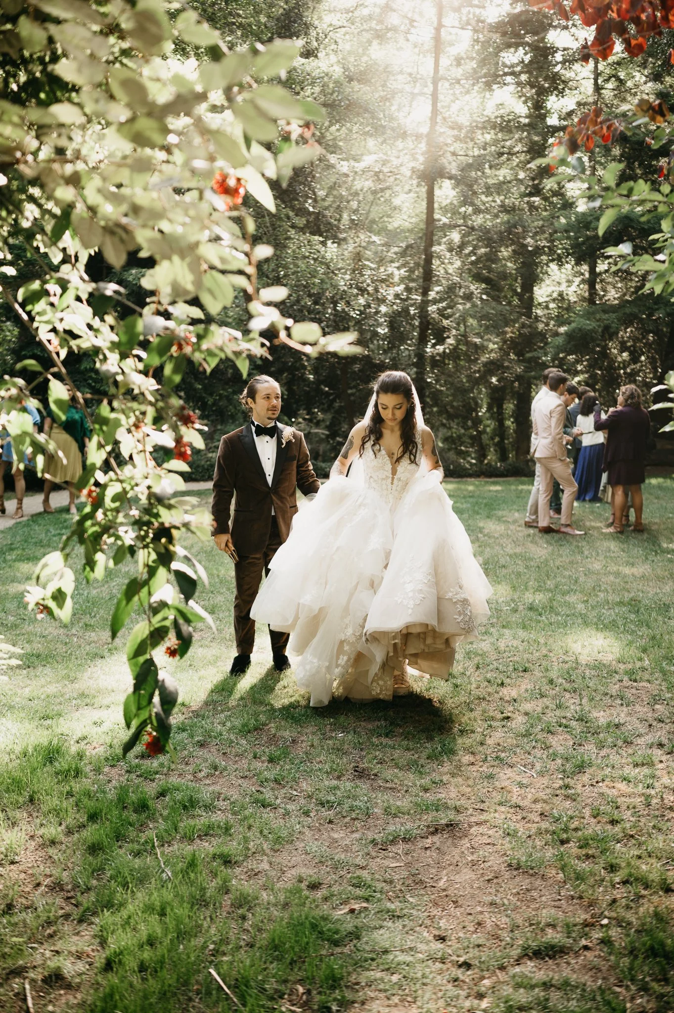 Glen Oaks Big Sur wedding bride and groom walking across grassy area