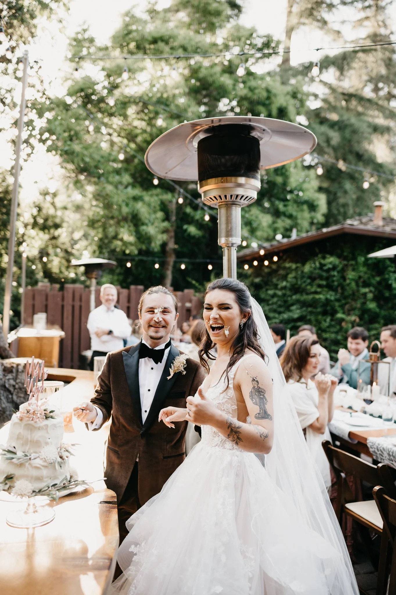 Glen Oaks wedding bride and groom with wedding cake on their faces