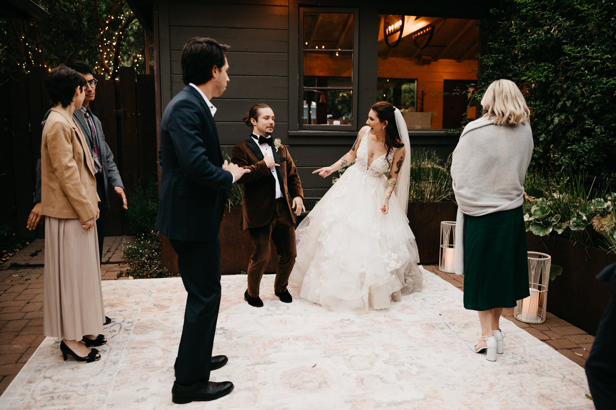 Big Sur Wedding Bride and groom dancing along side of their guest at Glen Oaks