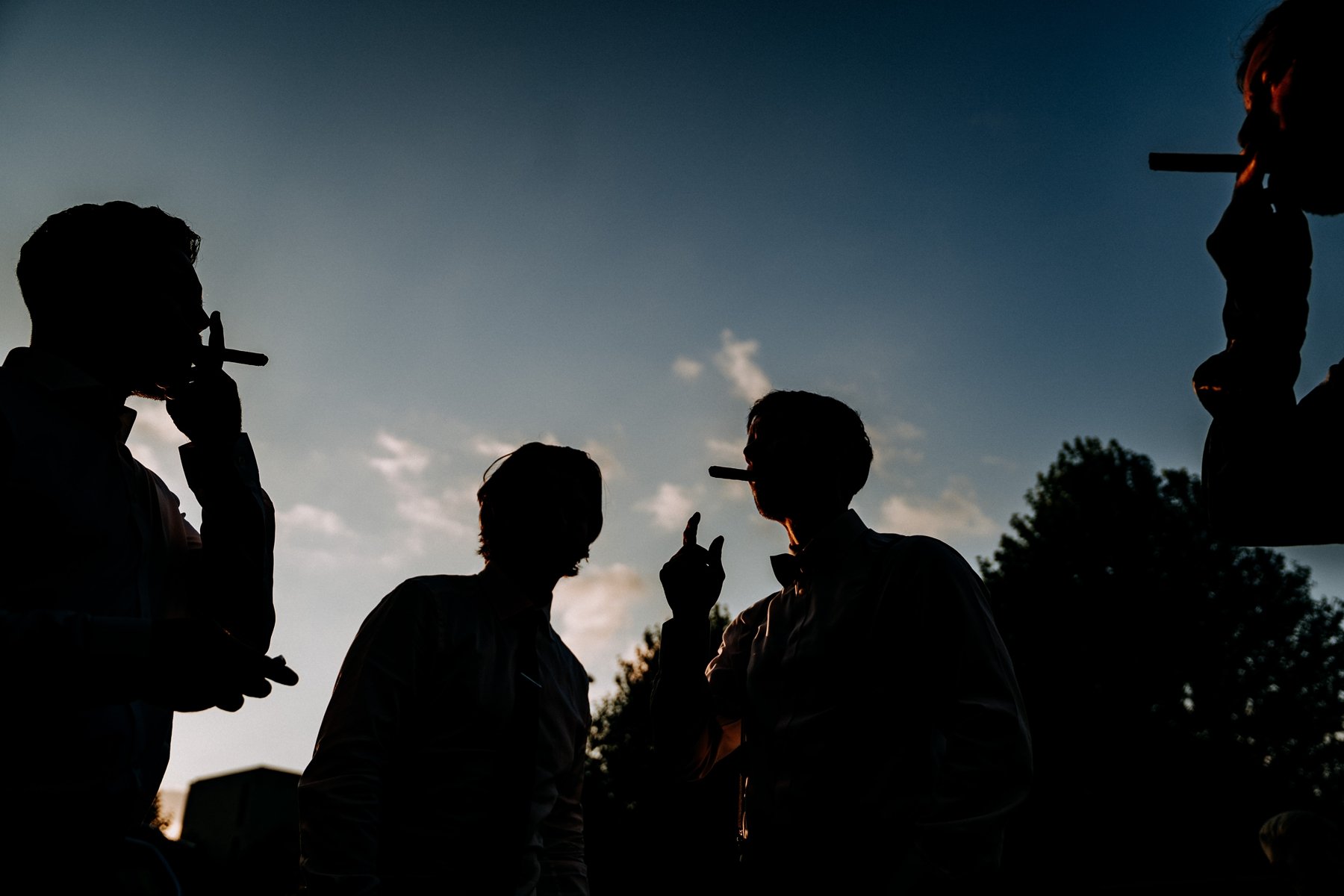 groomsmen smoking cigars 