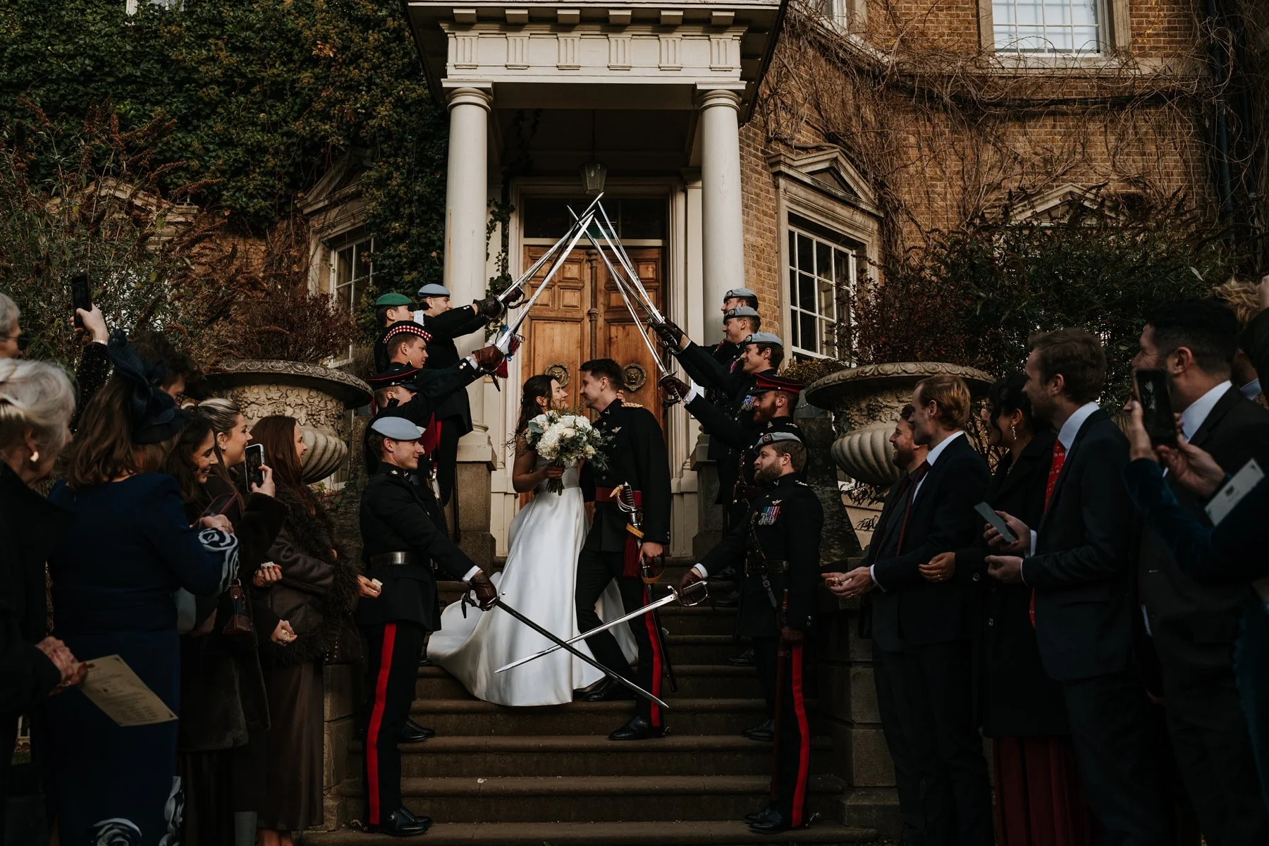 bride and groom at hampton court house surrey