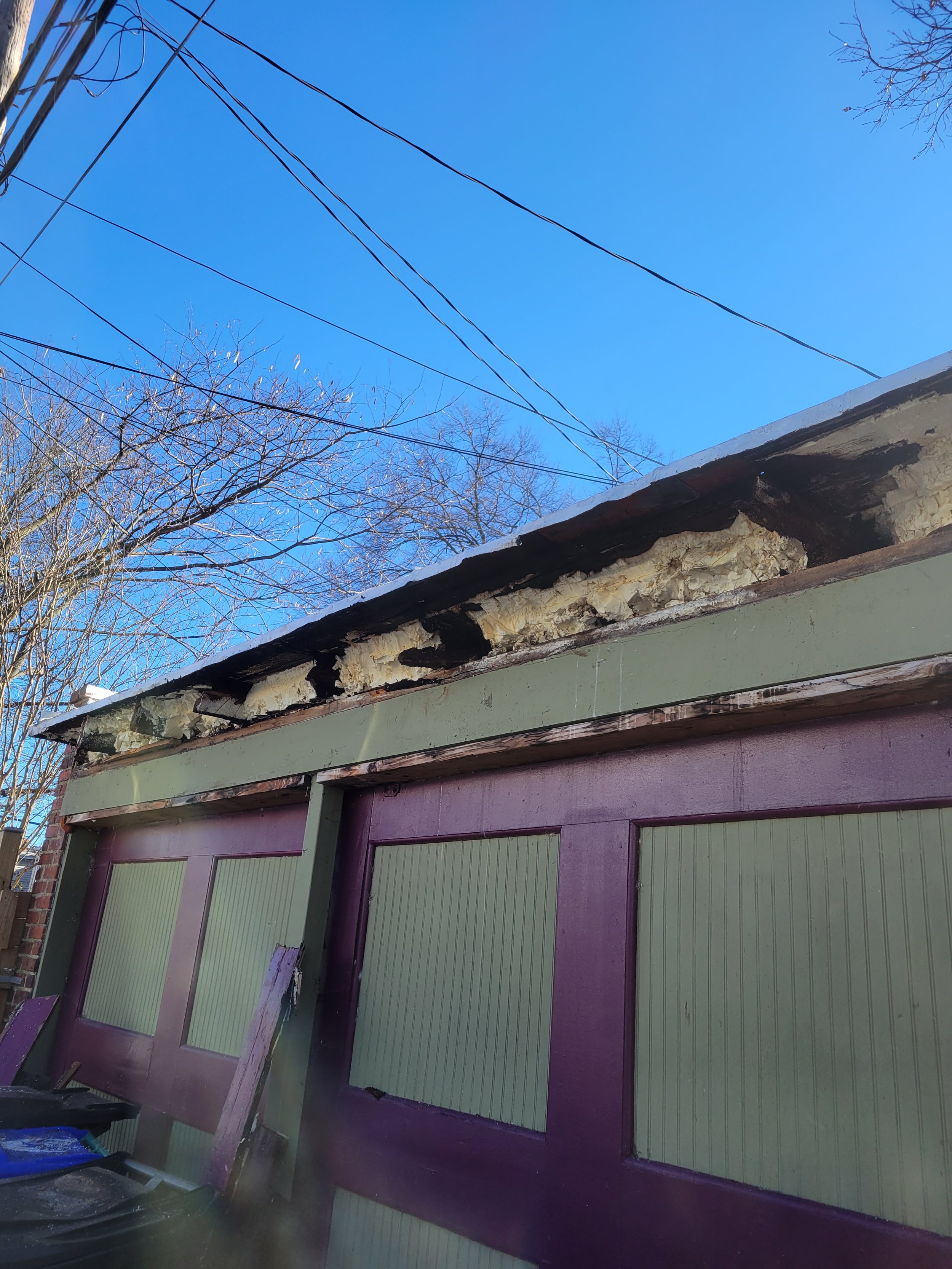 Rotted out roof joists on a 100 yr old garage. Now repaired!