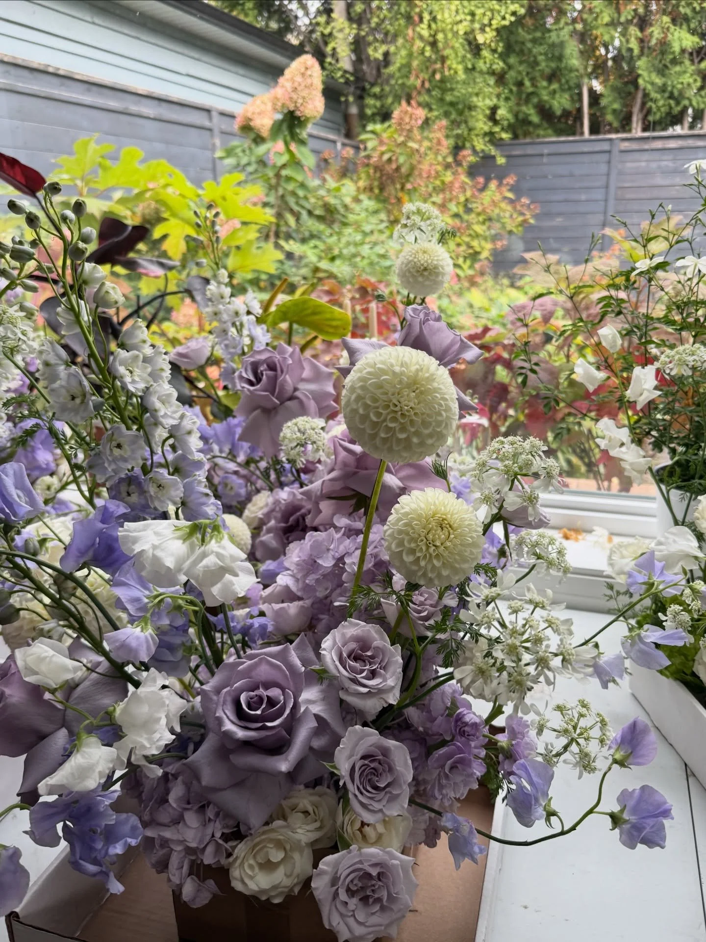 Back in the studio this morning thinking about warmer days with my garden full of colour.  These sweet lavender and white centrepieces were for a baptism last fall.