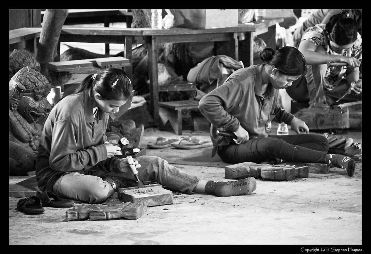 The Sanctuary of Truth, Pattaya, Thailand --
Wood carvers appeared largely to be female, some -- as here -- working in a building
located adjacent to the Sanctuary.