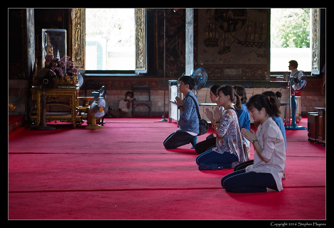 Wat Suthat, Bangkok, Thailand --
Devotions before the Buddha.