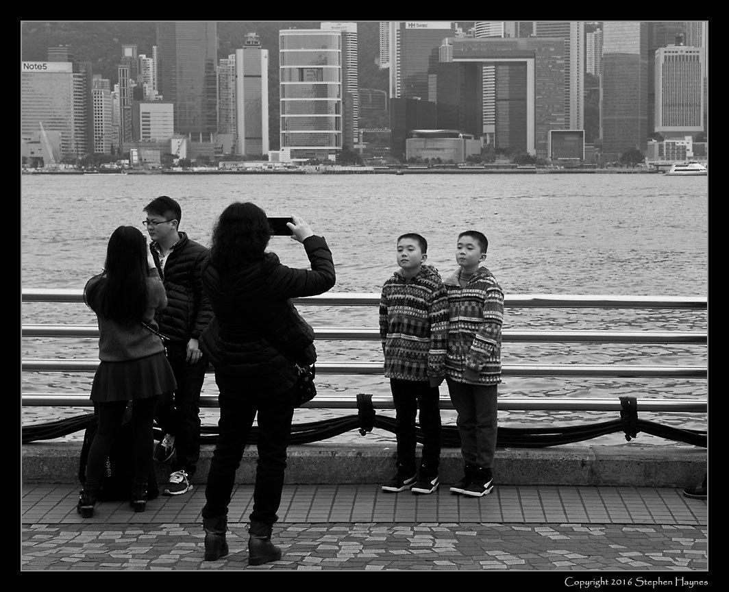 Kowloon --
Photographing boys against the Hong Kong skyline.