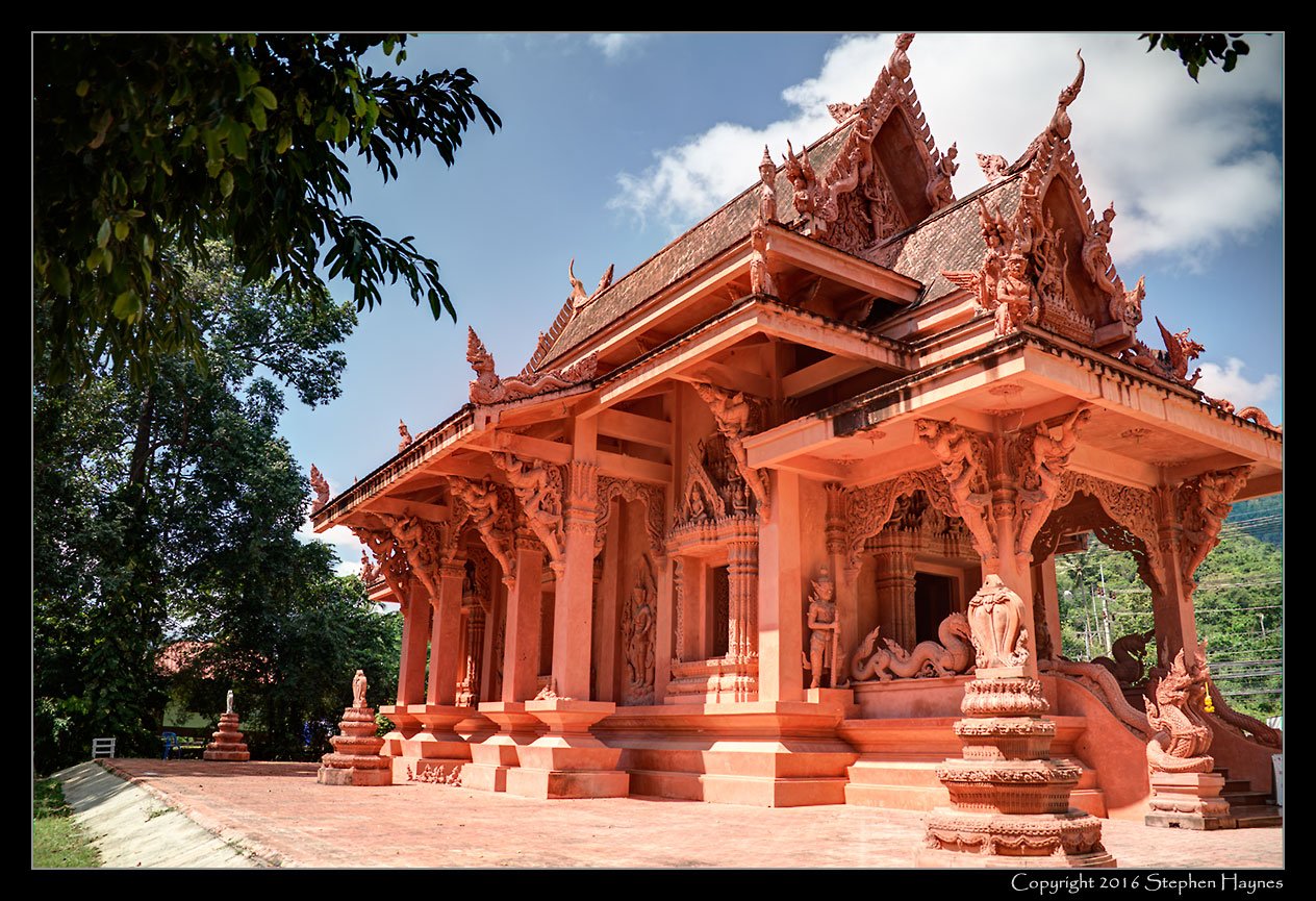 Koh Samui, Thailand --
Two views of Wat Ratchathammaram, a temple built of bricks made from the indigenous
red clay. The clay was then used to sculpt details on both exterior and interior. (HDR images.)
