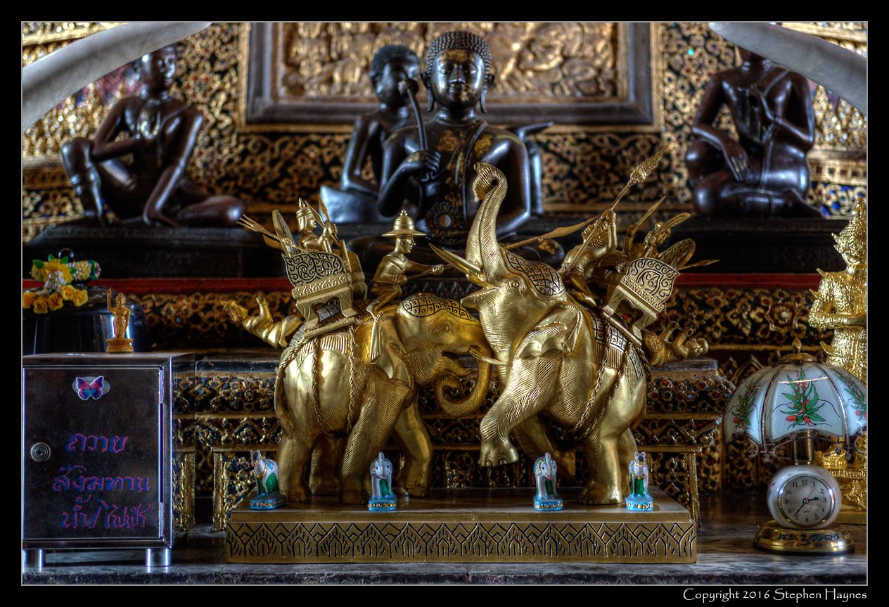 Wat Suthat, Bangkok, Thailand --
A small tableau behind the Buddha. (An HDR image.)