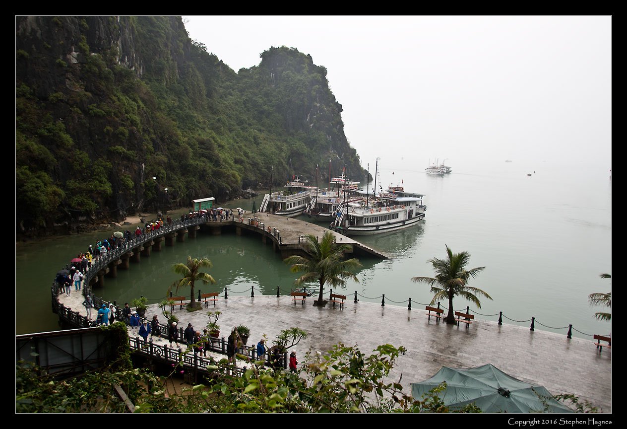 Halong Bay, Vietnam --
We made landfall to visit the Thien Cung Cave, a major attraction. (The cave had essentially hollowed
out the hill behind me as I took this picture.)