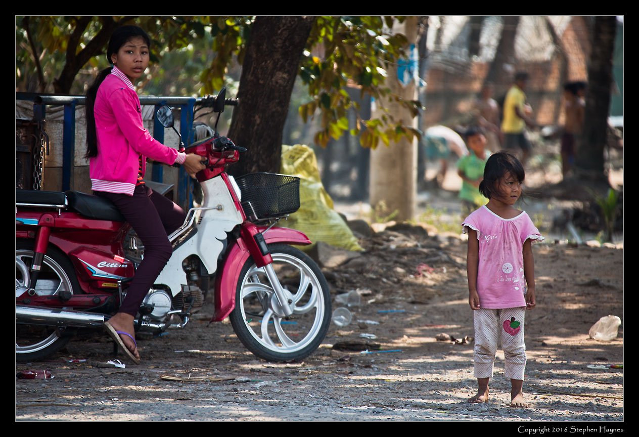 Ropang Ropov Fishing Village, On the road east from Sihanoukville, Cambodia --
Onlookers.