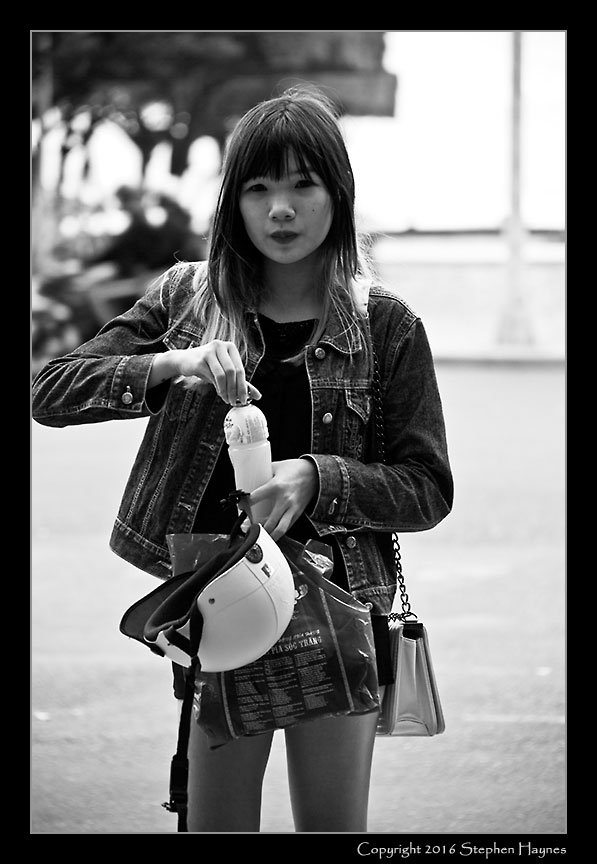 Nha Trang, Vietnam --
The photographer's assistant. When I last visited Vietnam (Hanoi in 1997) I never saw women
dressed like this. I'd be curious whether the liberality of her attire is a function of her youth or
living in Nha Trang (being part
