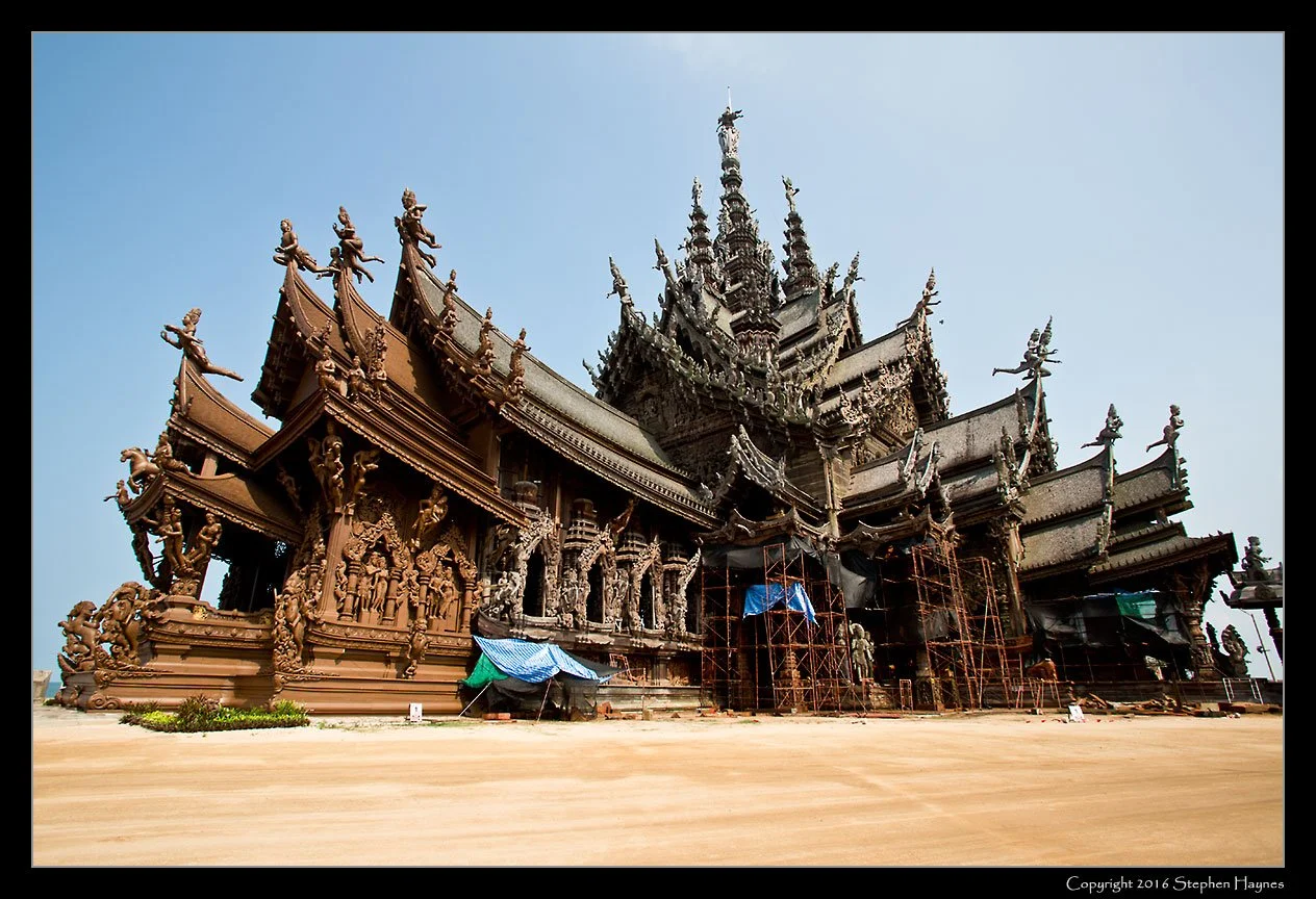 The Sanctuary of Truth, Pattaya, Thailand -- 
The massive construction, The Sanctuary of Truth, although filled with religious iconography,
is not a temple.  Conceived by a Thai businessman in 1981, it is not expected to be
completed until 2050.  In