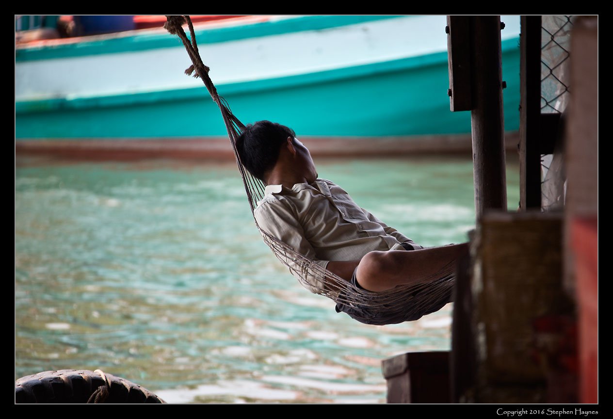 Ropang Ropov Fishing Village, On the road east from Sihanoukville, Cambodia --
A nap, or sleeping during the day in preparation for the evening's departure
for the fishing grounds?