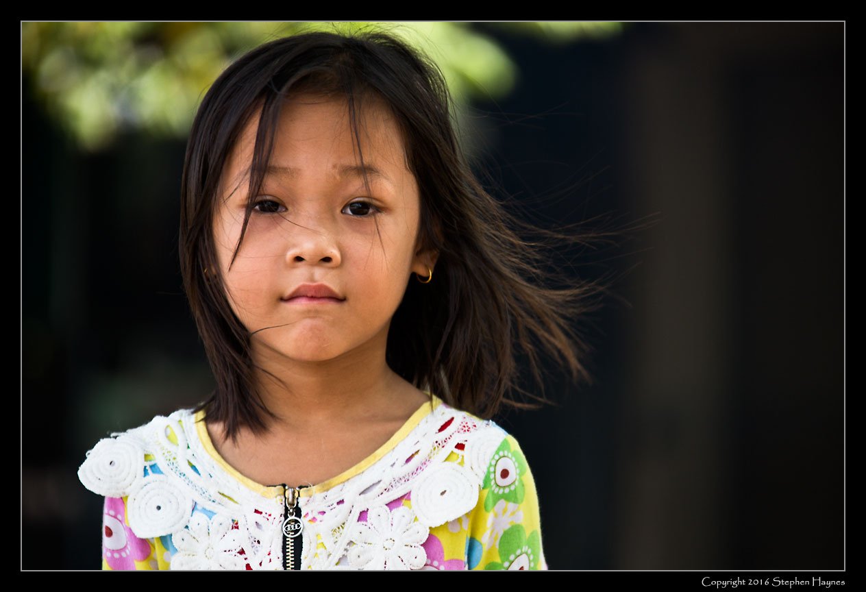 Ropang Ropov Fishing Village, On the road east from Sihanoukville, Cambodia --
One of the curious children. If there were an iconic photograph for our visit to Cambodia,
if not for the entirety of southeast Asia, this would be it.