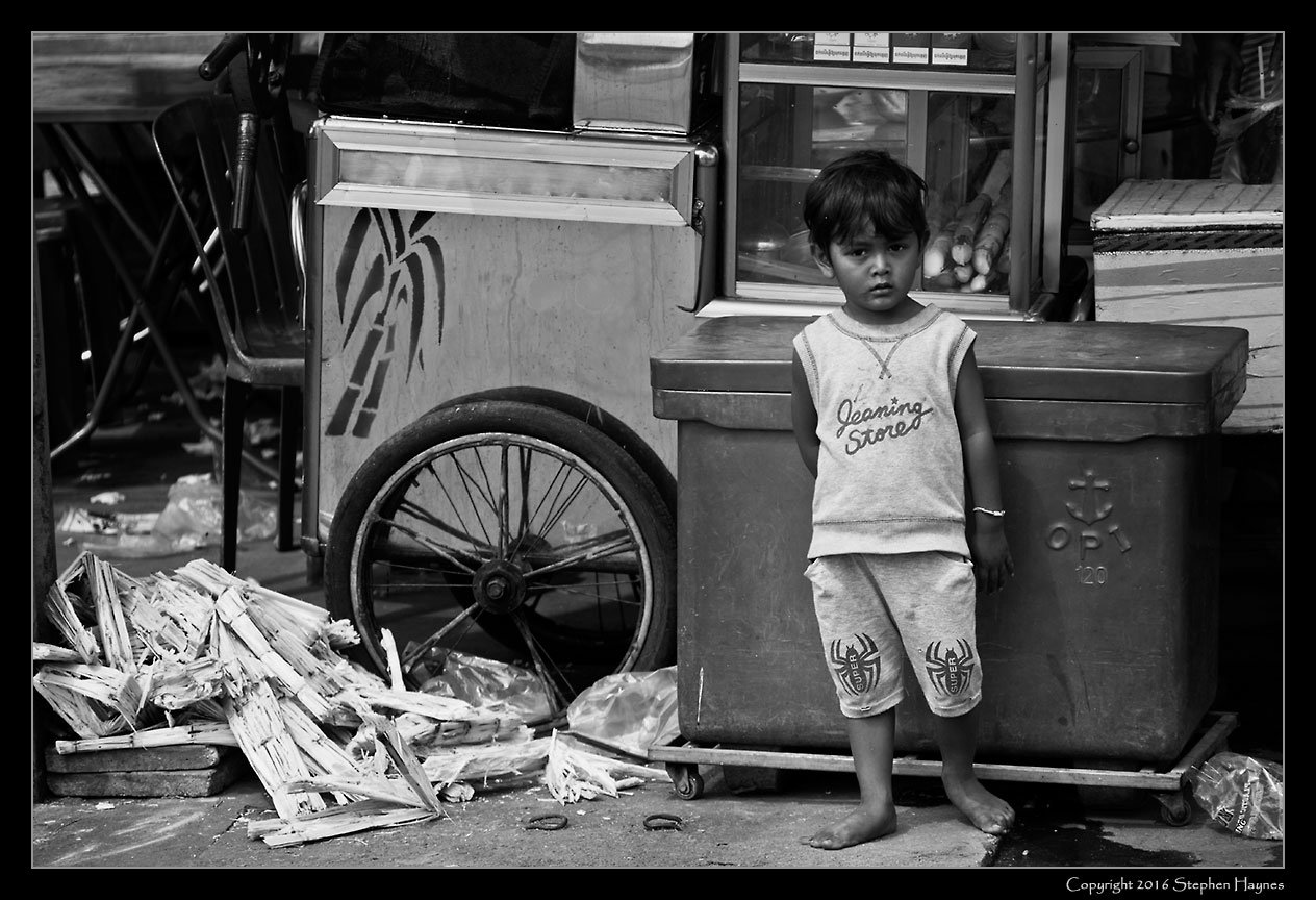 Kampot Town, On the road east from Sihanoukville, Cambodia --
Child watching the tourists.