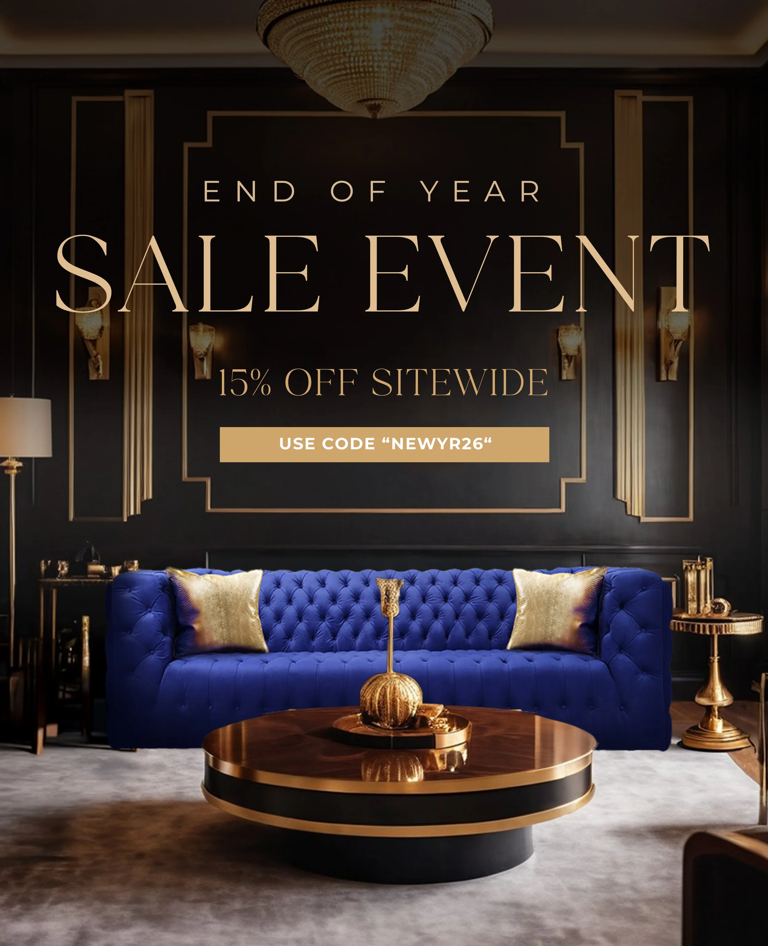 Elegant living room with a dark wall, gold decor accents, a large crystal chandelier, a vivid blue tufted sofa with gold pillows, a round coffee table with a decorative gold orb and tray, and two gold side tables with lamps.