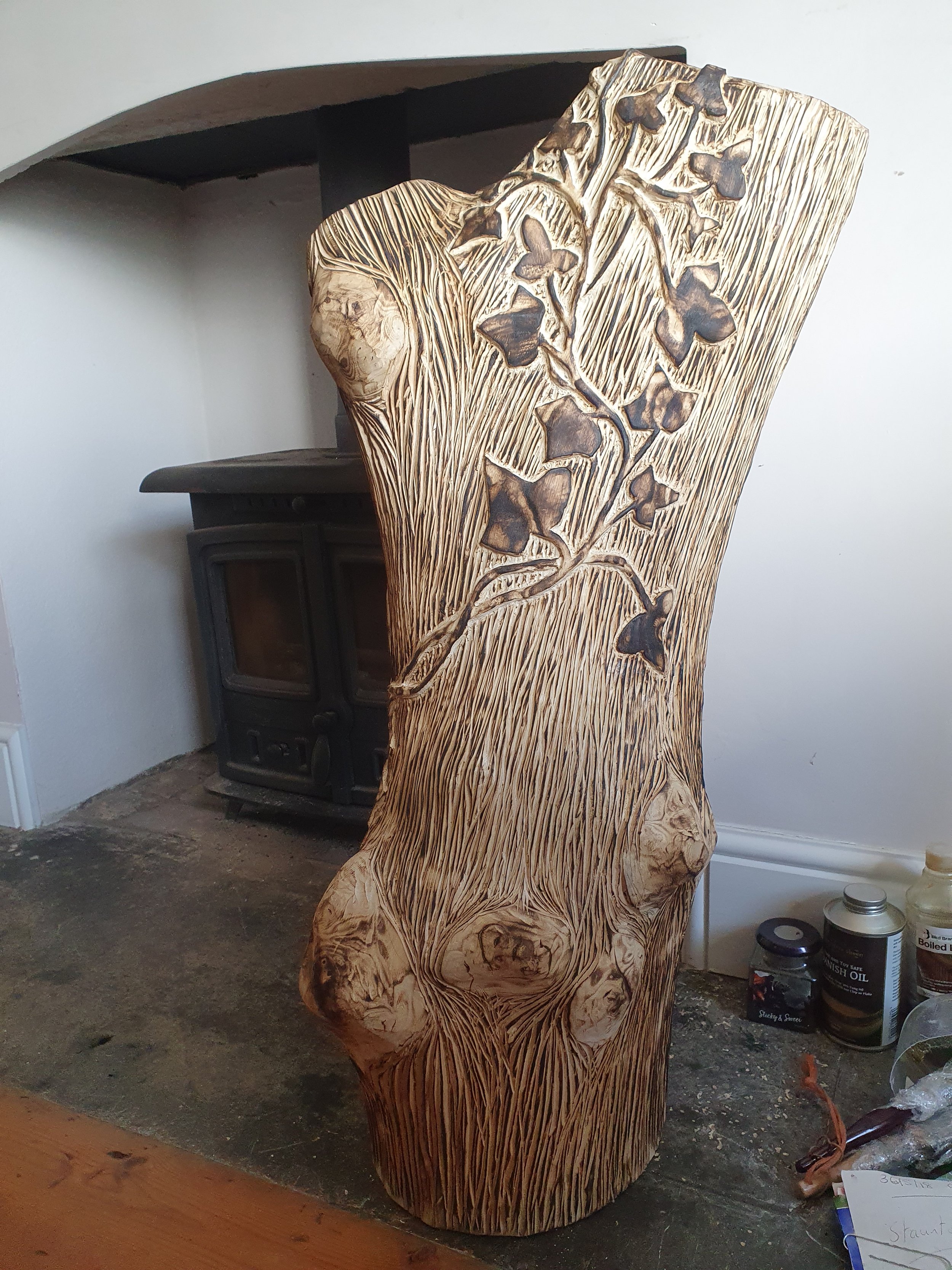 "This was a project I undertook during Lockdown in 2020. The material is Ash, It was de-barked and scraped to shape. I took some ivy from a tree and traced it onto the trunk, it was quite surprising how different the leaves were but I copied each one