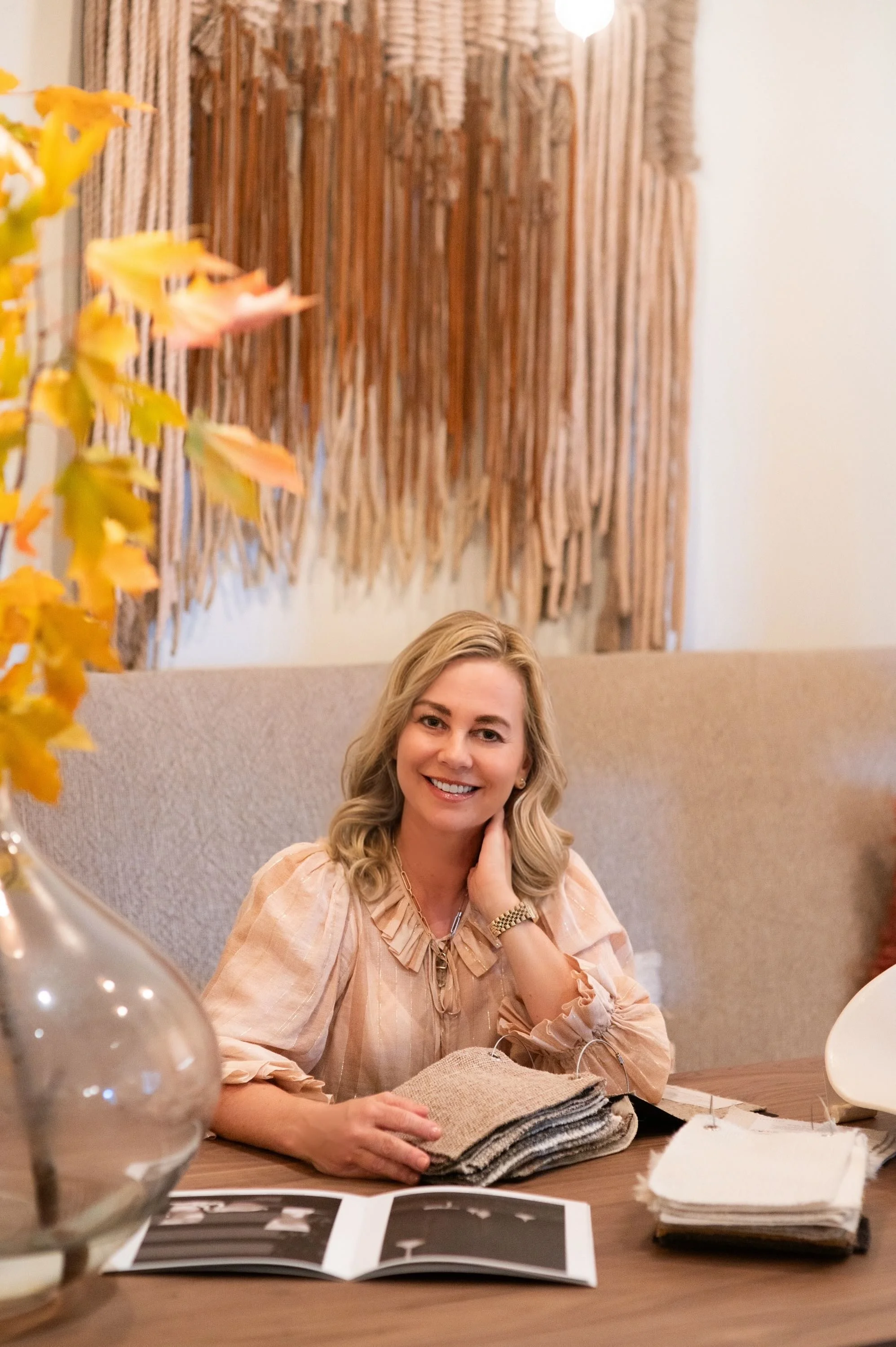 Patricia Kennedy of Rendezvous Design at her desk reviewing design books