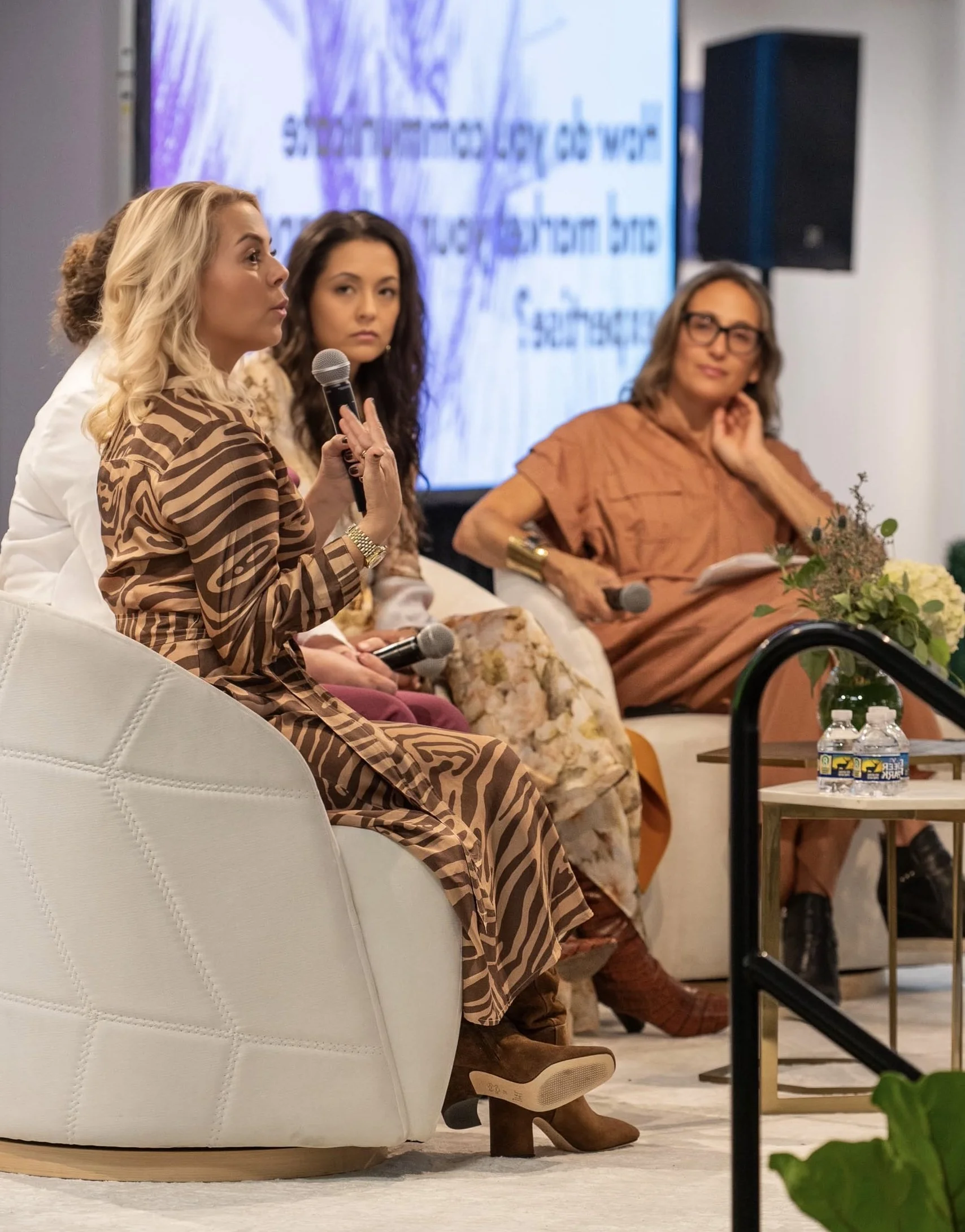 Patricia Kennedy speaking with fellow panelists during a design discussion at High Point Market