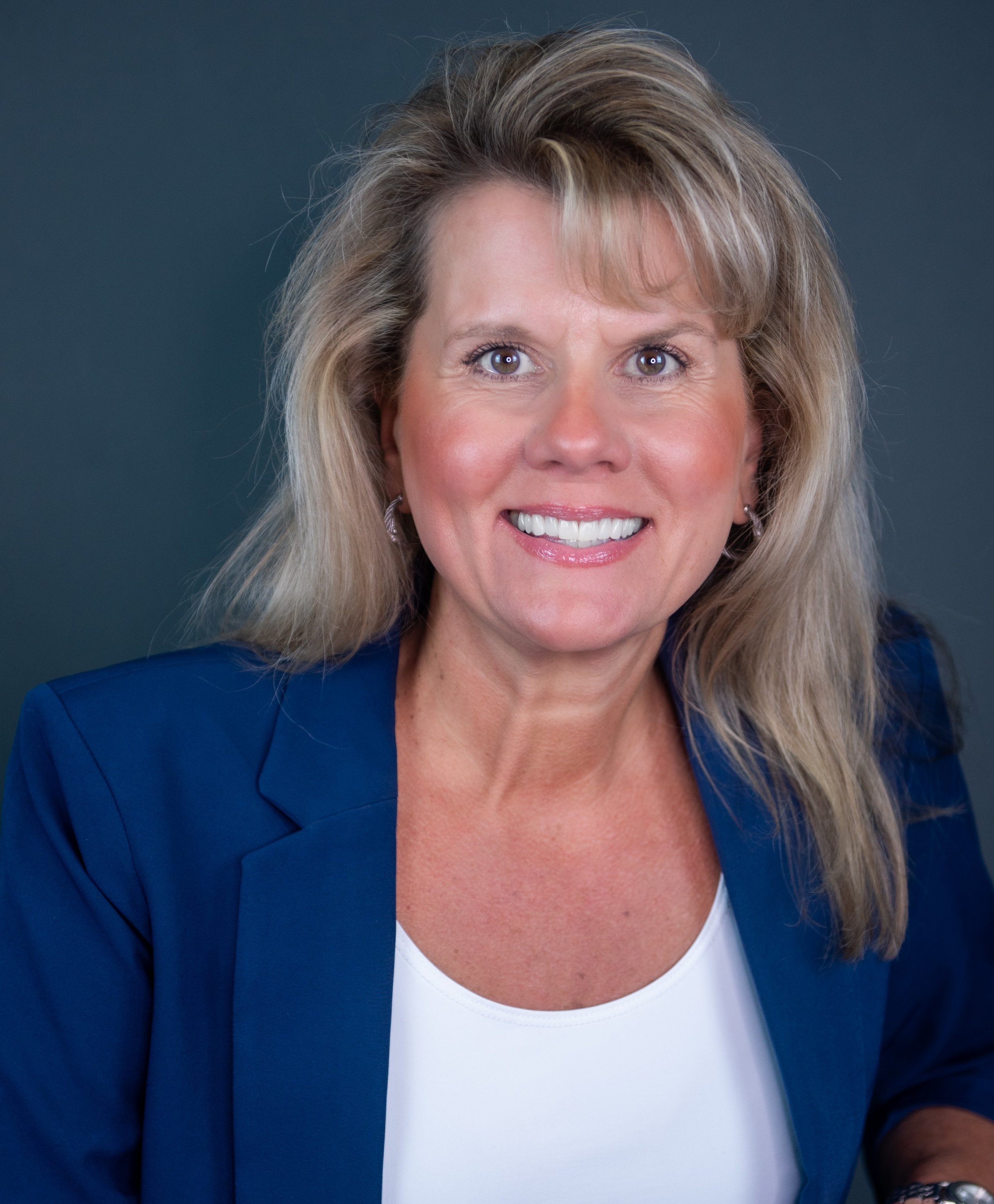 Dawn F. Landry, founder of Authentizity, wearing a blue coat.