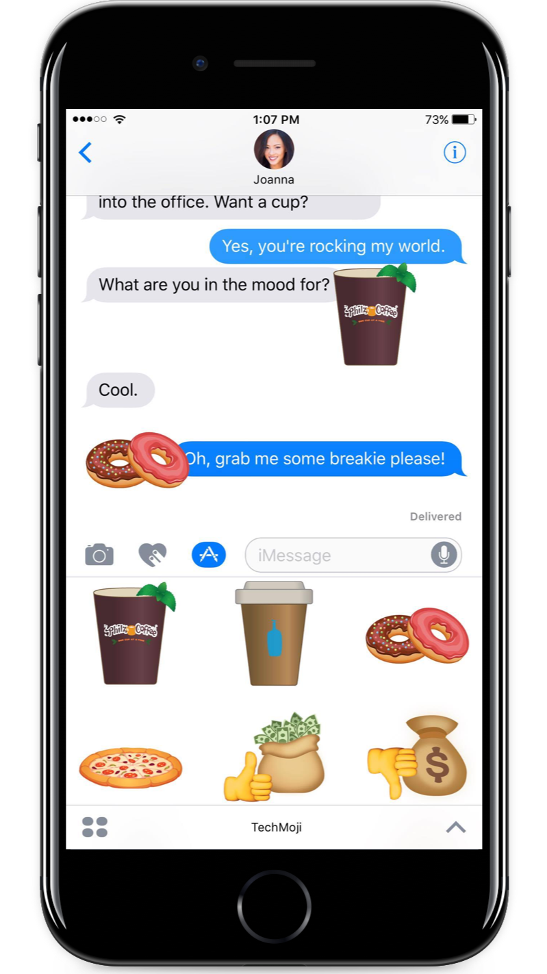 A smartphone screen displaying a text conversation with Emoji stickers, including coffee, donuts, pizza, a money bag, and a thumbs-up.