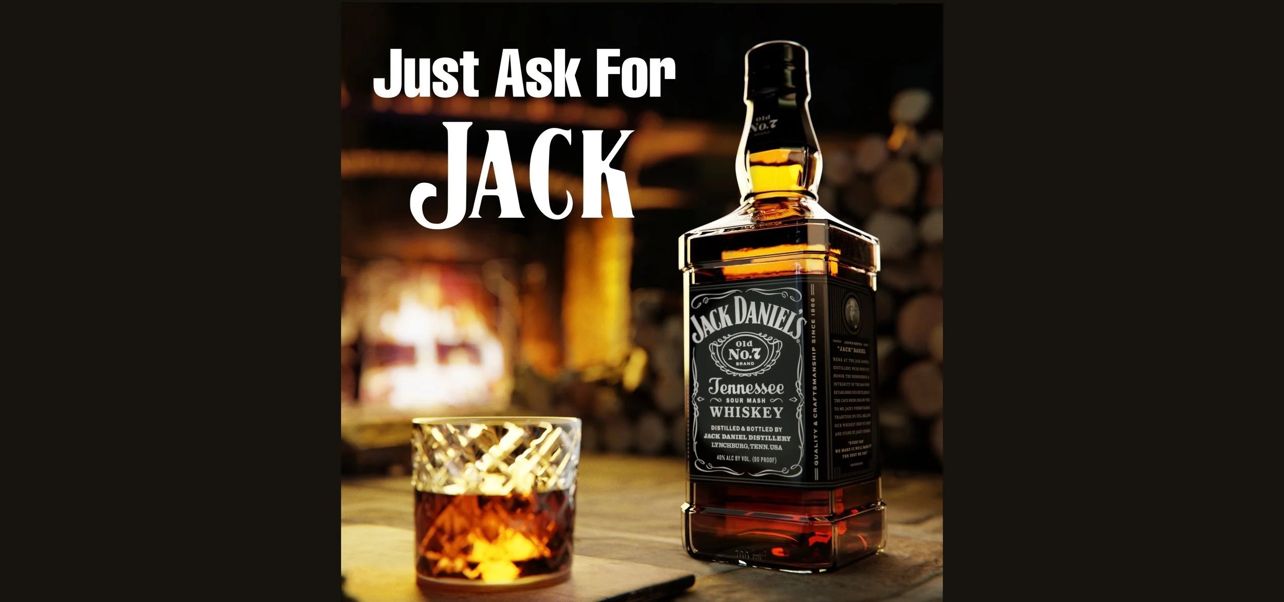 A bottle of Jack Daniel's Tennessee whiskey and a glass filled with whiskey on a wooden surface, with the text 'Just Ask For JACK' at the top.