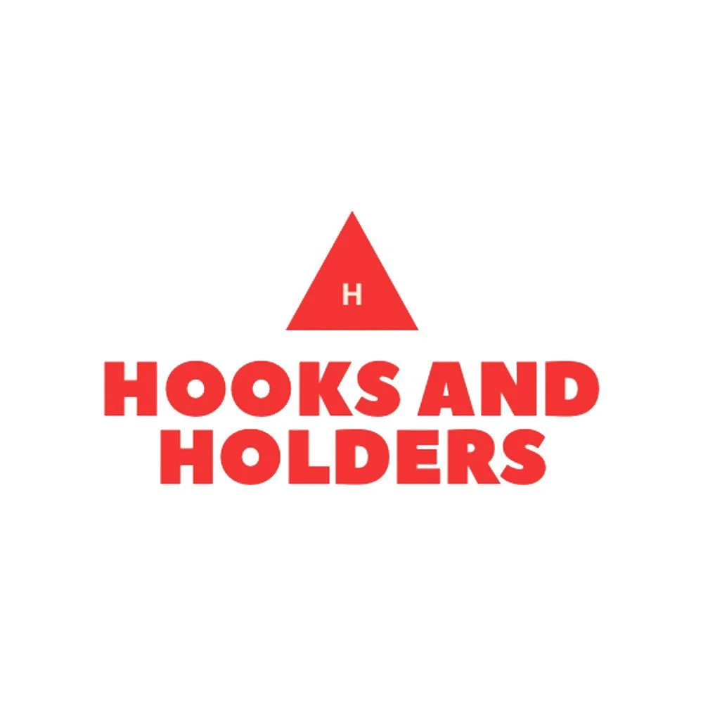 Logo with red triangle with the letter H above the text 'HOOKS AND HOLDERS' in bold red letters.
