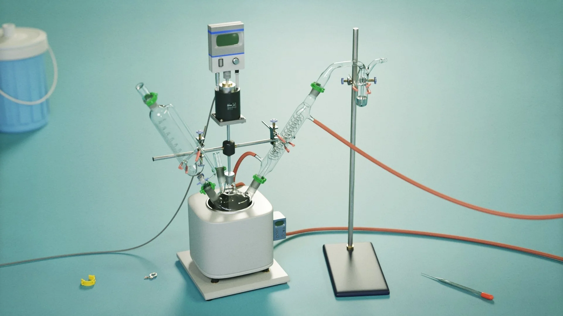 Laboratory apparatus including glassware, a magnetic stirrer, and tubes set up on a light blue laboratory bench.