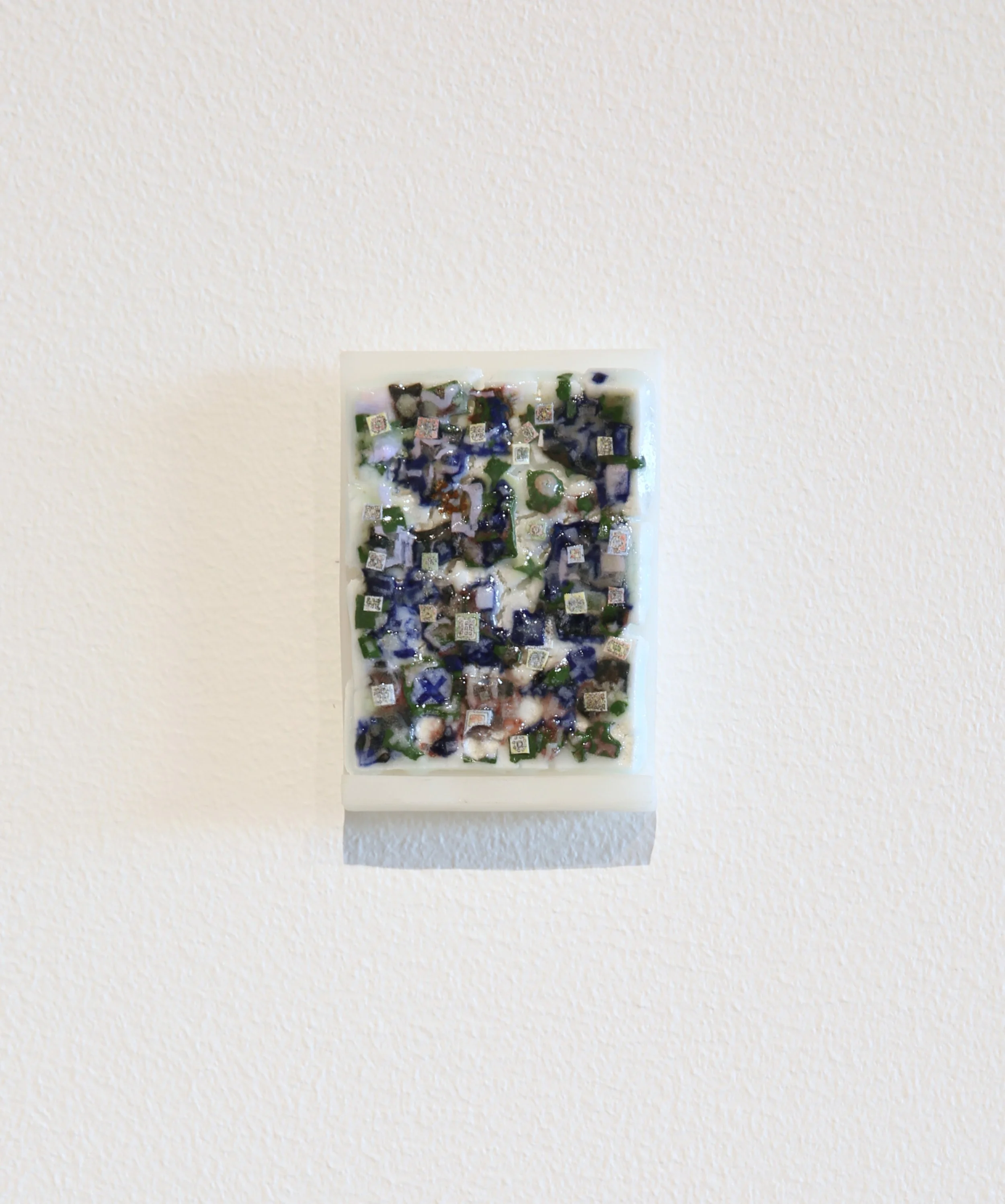 Trey Ross. 028 . 2026. Porcelain, glaze, and urethane shelf. 3.5 x 2.5 inches.