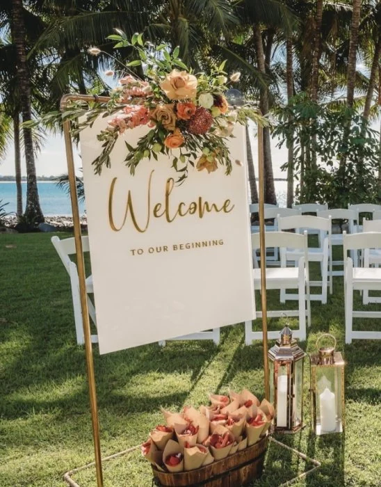 White Acrylic Rectangle with Gold Vinyl Text on Copper Pipe Stand
