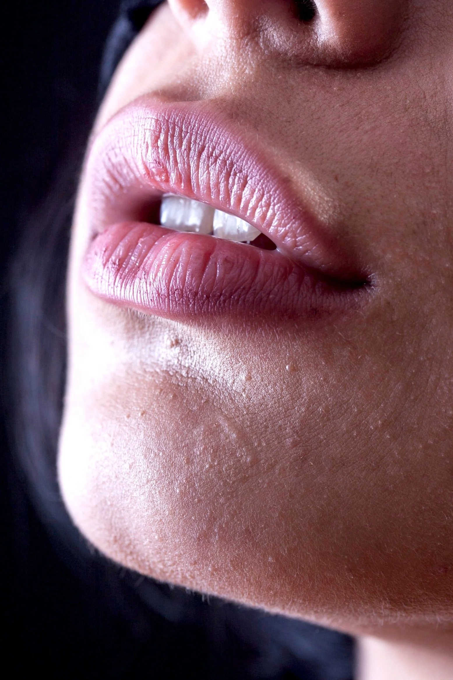 Close-up of a person's lips and chin