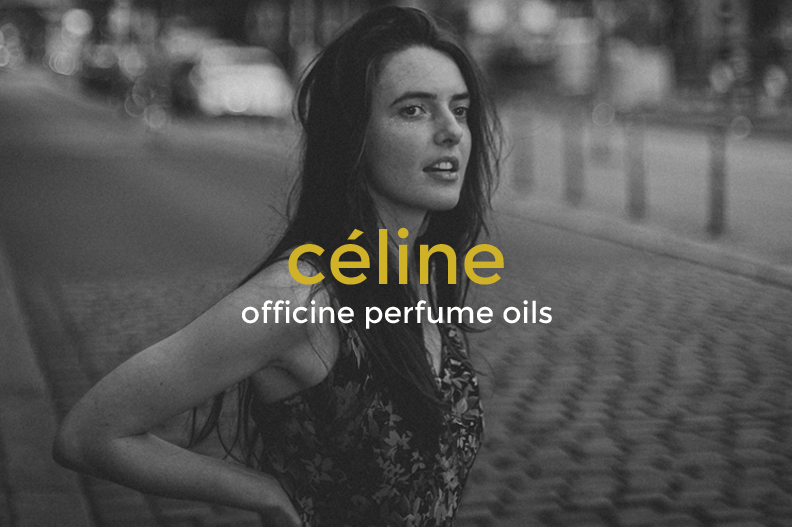 Black and white photo of a woman with long dark hair standing outdoors on a city street, wearing a floral top, with text overlay "céline" and "officine perfume oils".